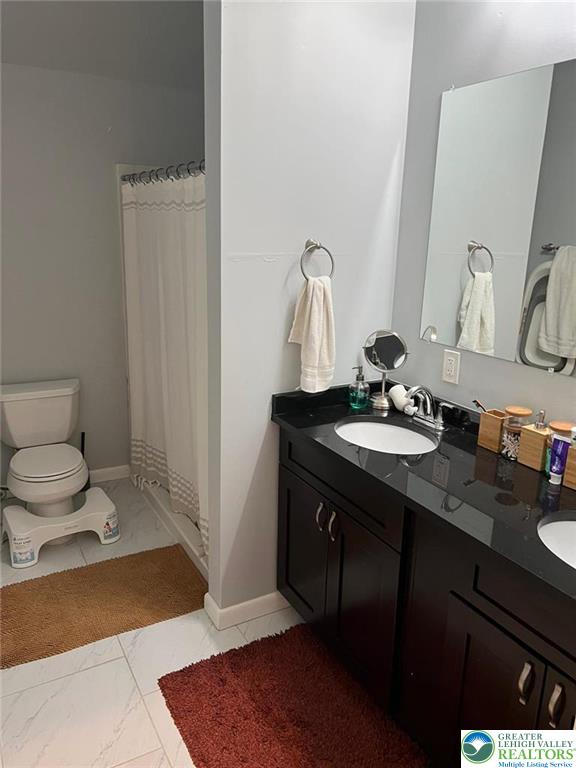 623 Walnut Street, Unit C2 Easton, PA 18042 - Photo 14 of 26 a bathroom with a sink and a mirror