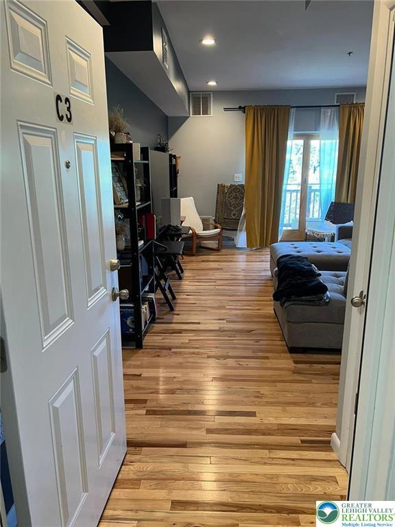 623 Walnut Street, Unit C2 Easton, PA 18042 - Photo 3 of 26 a living room with furniture and a wooden floor