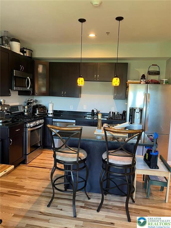 623 Walnut Street, Unit C2 Easton, PA 18042 - Photo 7 of 26 a kitchen with a table and chairs