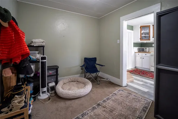 a view of an empty room with windows