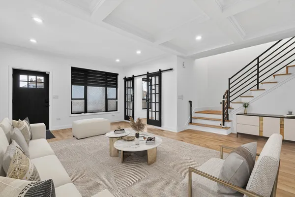 a living room with furniture and wooden floor