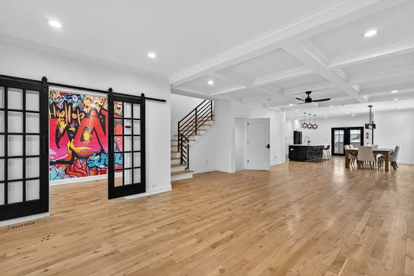 a view of an empty room with furniture and toys