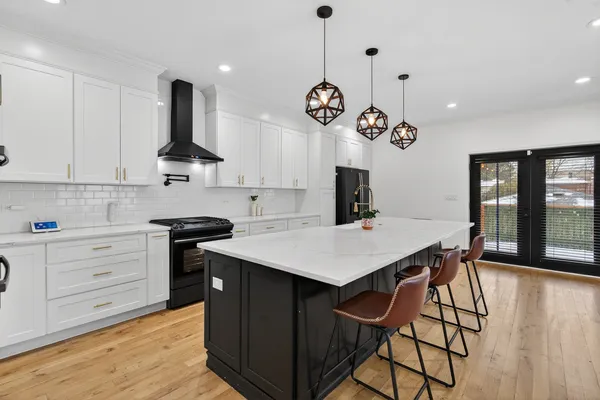 a kitchen with a table and chairs in it