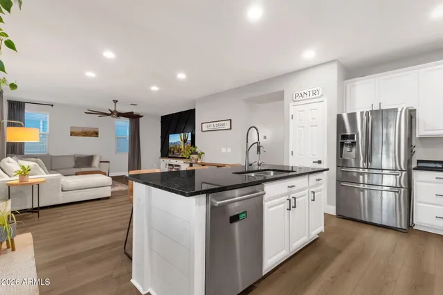 a bedroom with a bed and a large mirror