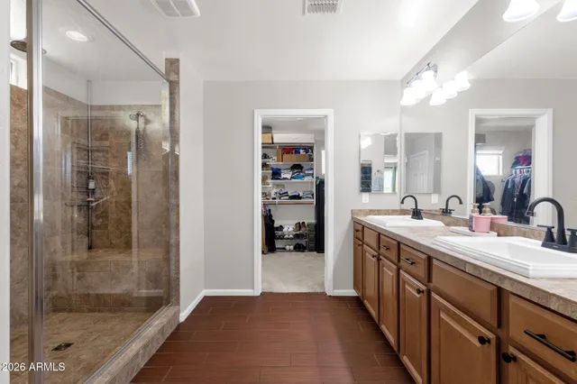 a view of a house with pool and sitting area