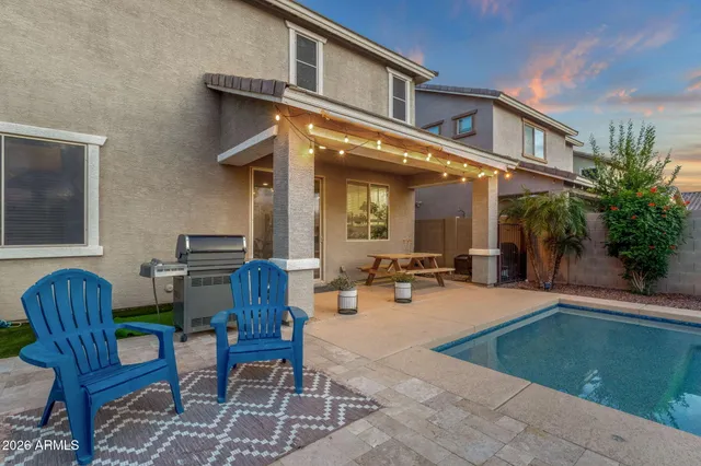 a view of a swimming pool with a yard