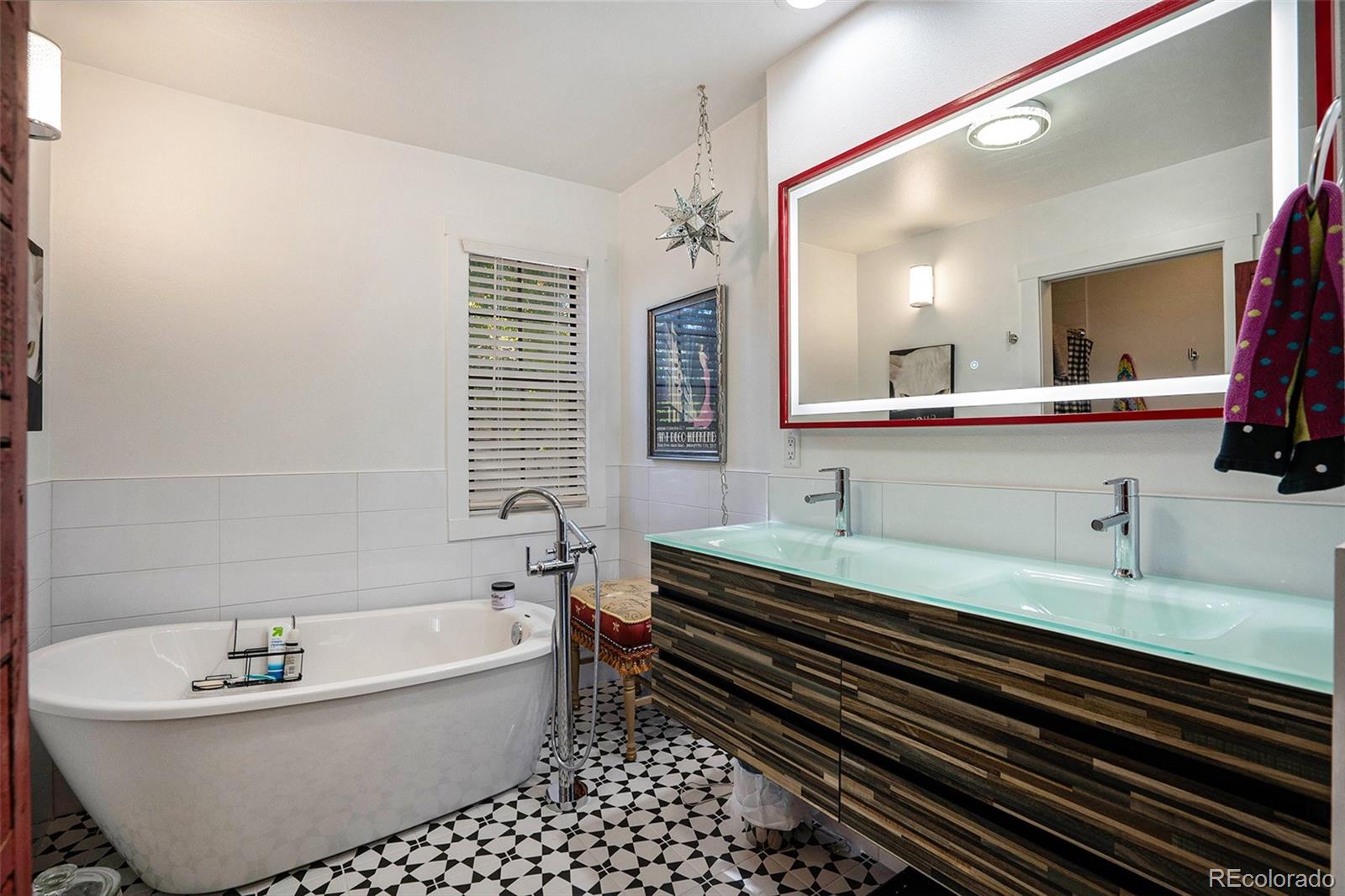 1600 South Quebec Way, Unit 10 Denver, CO 80231 - Photo 15 of 29 a bathroom with a bathtub and a sink