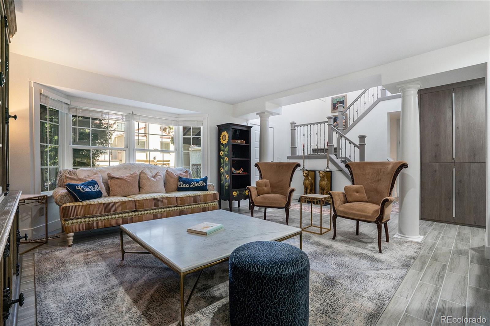 1600 South Quebec Way, Unit 10 Denver, CO 80231 - Photo 2 of 29 a living room with furniture and a window
