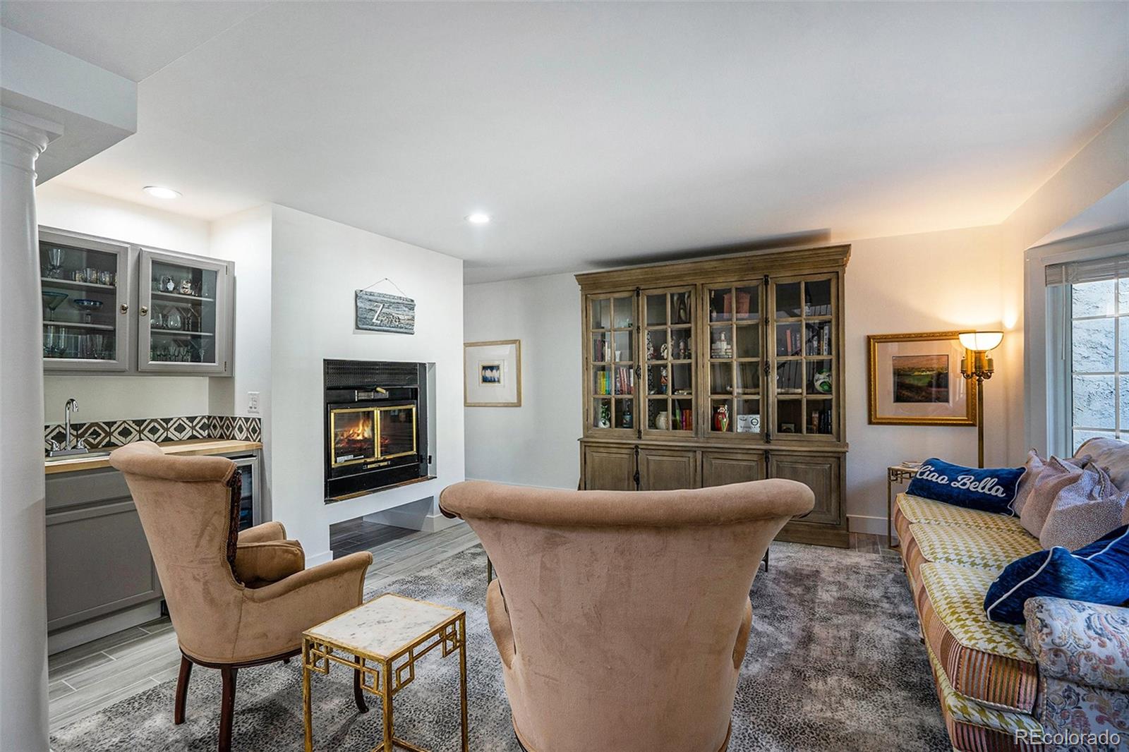 1600 South Quebec Way, Unit 10 Denver, CO 80231 - Photo 3 of 29 a living room with furniture and a fireplace