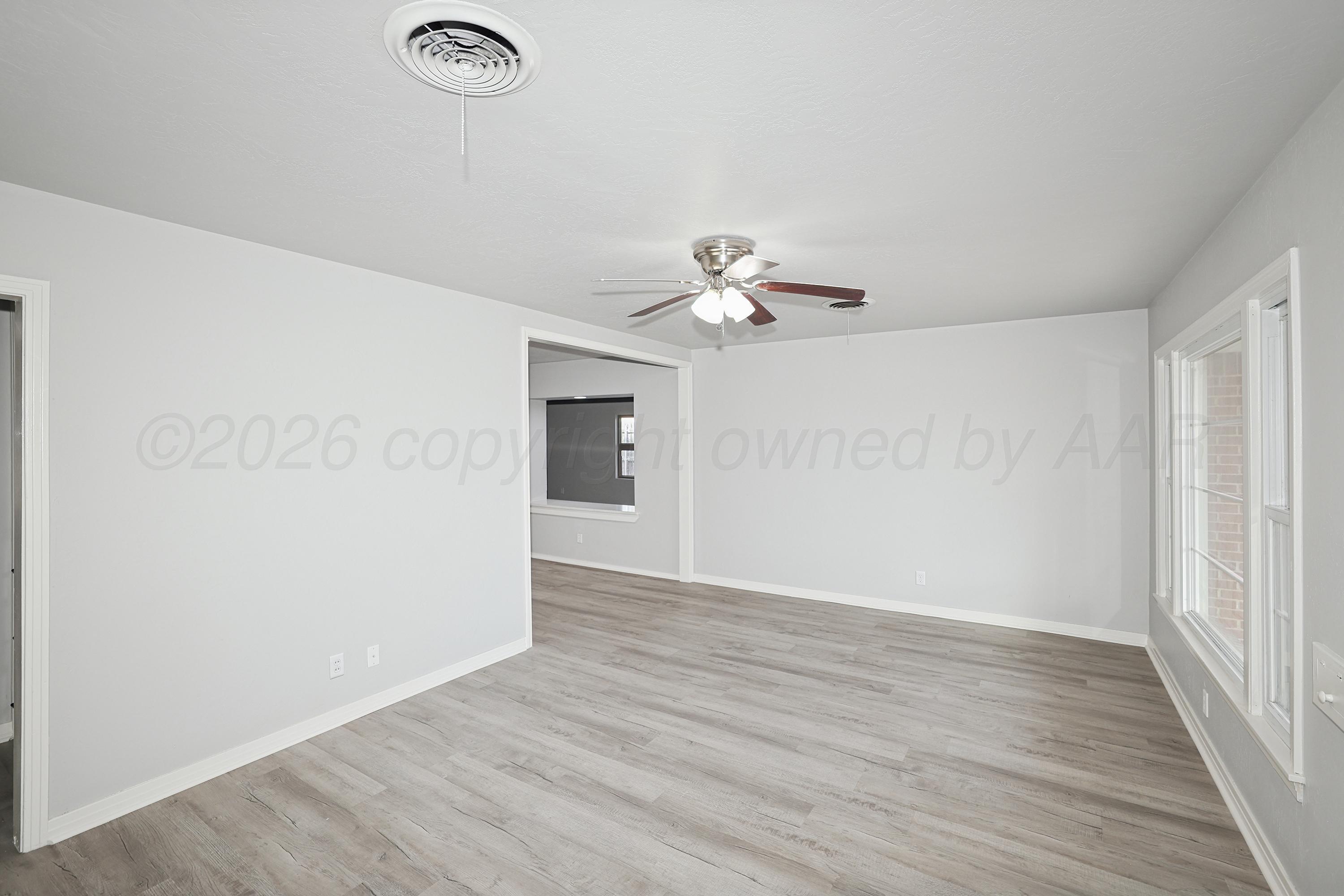 1602 Tularosa Street Amarillo, TX 79102 - Photo 4 of 33 a view of an empty room with wooden floor