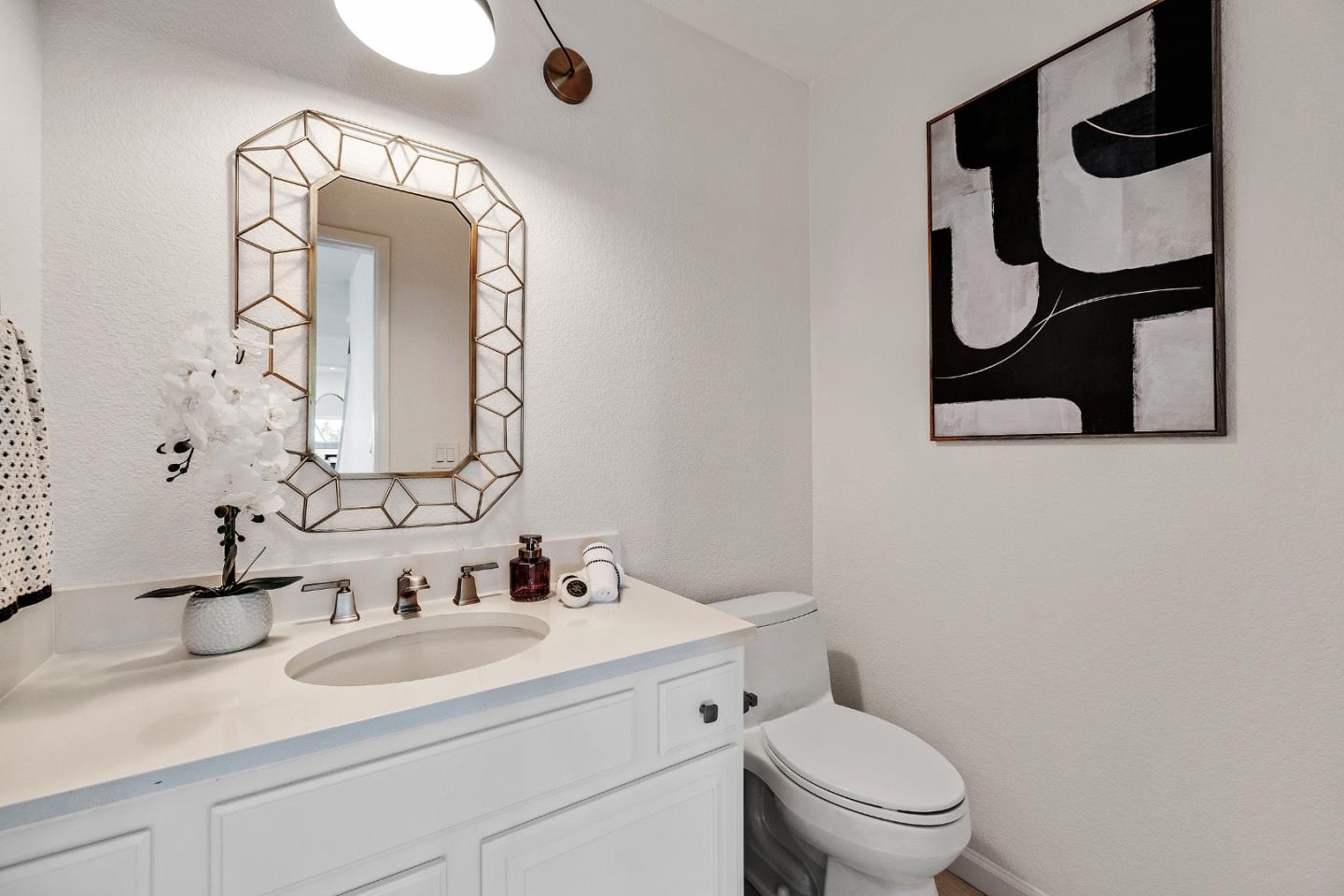 15 Parfait Lane Alameda, CA 94502 - Photo 11 of 35 a bathroom with a toilet sink vanity and mirror