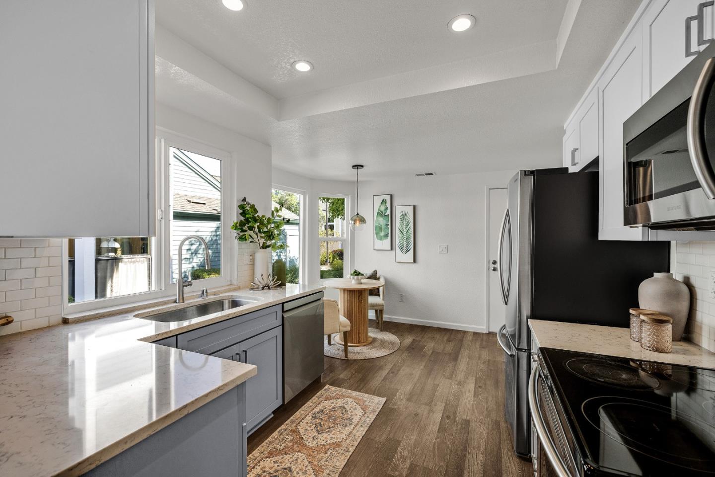 15 Parfait Lane Alameda, CA 94502 - Photo 12 of 35 a kitchen with stainless steel appliances granite countertop a sink stove and wooden floor