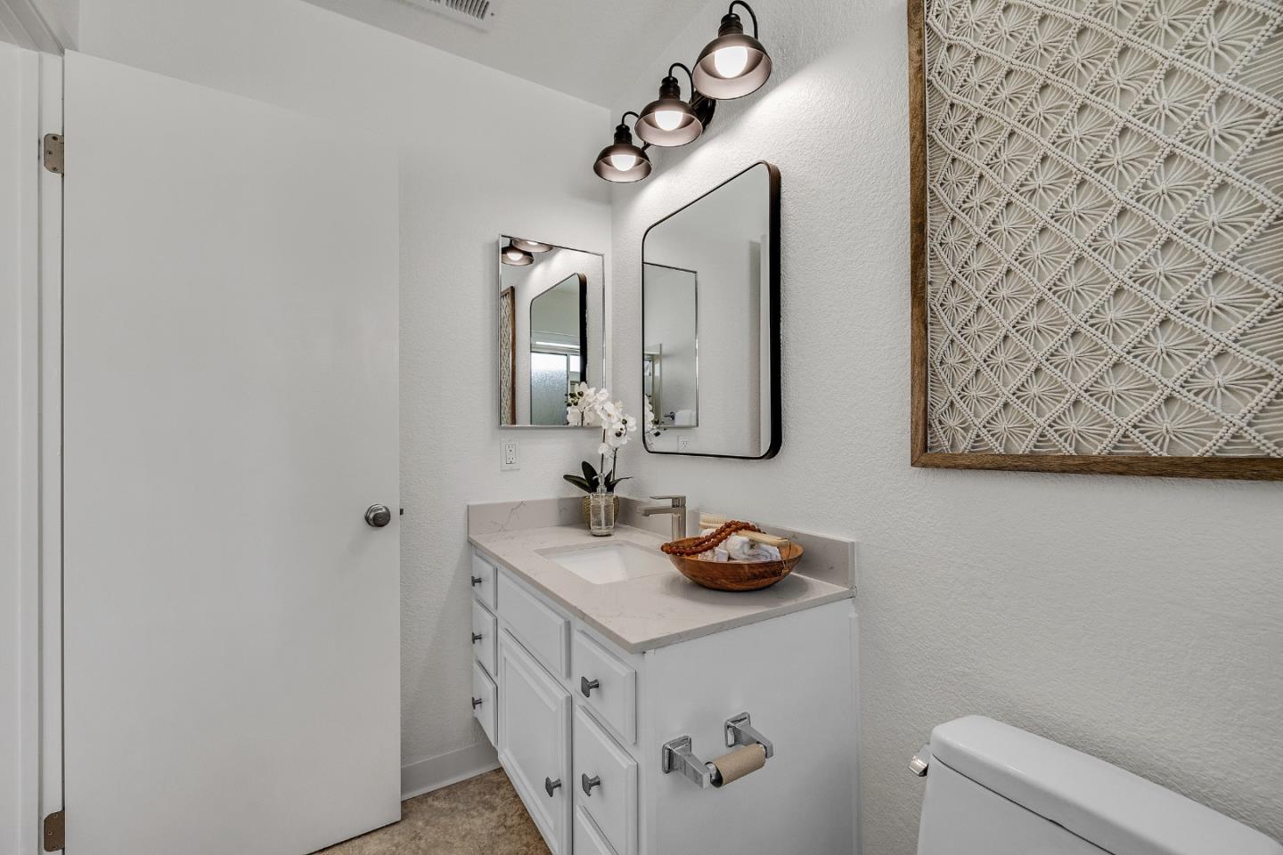15 Parfait Lane Alameda, CA 94502 - Photo 22 of 35 a bathroom with a sink and a mirror