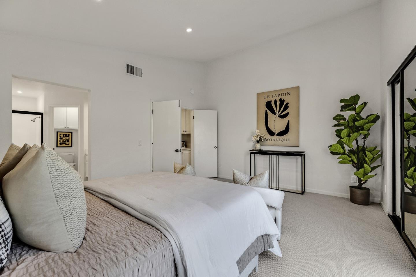15 Parfait Lane Alameda, CA 94502 - Photo 24 of 35 a bedroom with a bed and a potted plant