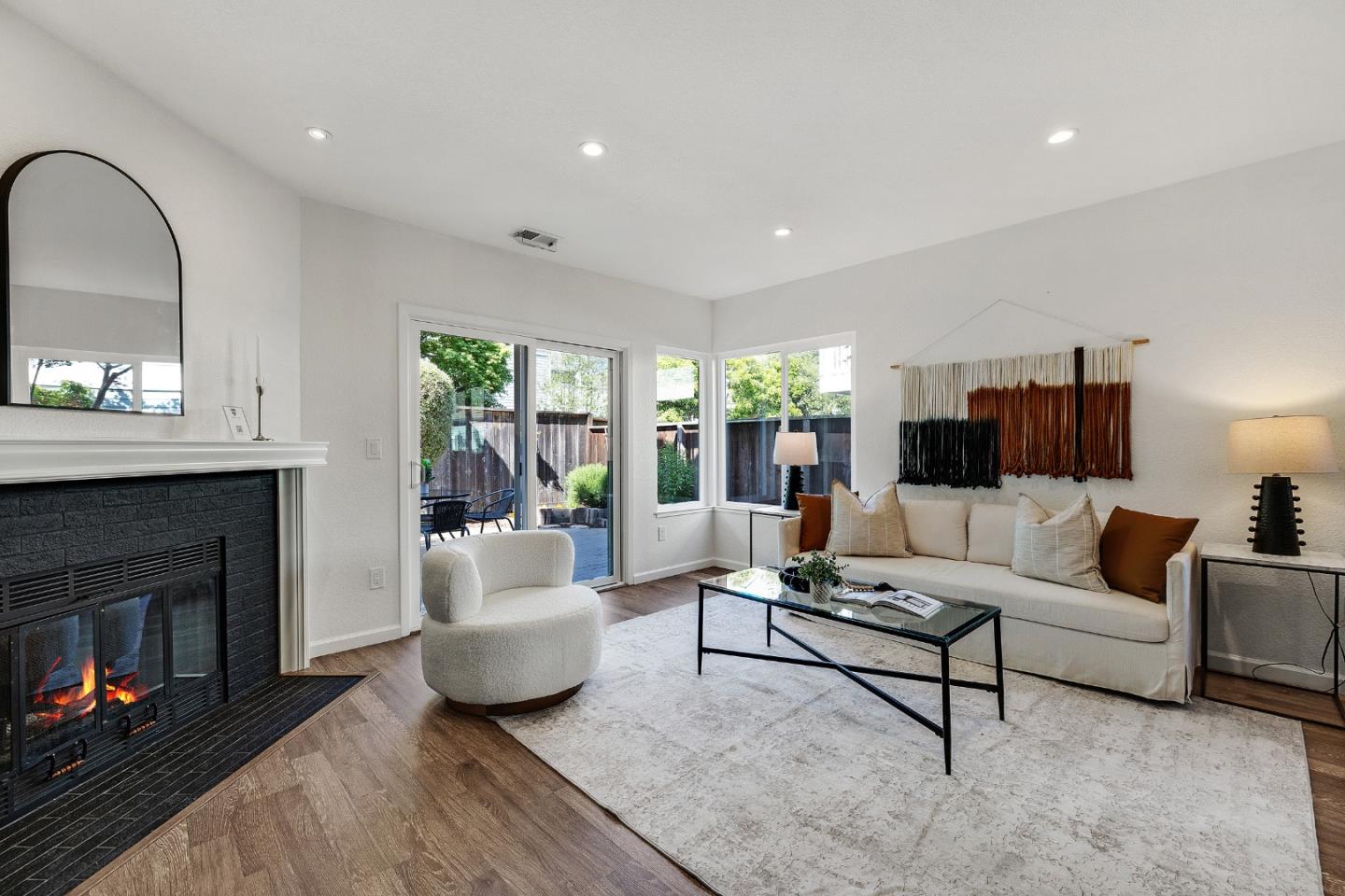 15 Parfait Lane Alameda, CA 94502 - Photo 10 of 35 a living room with furniture and a fireplace