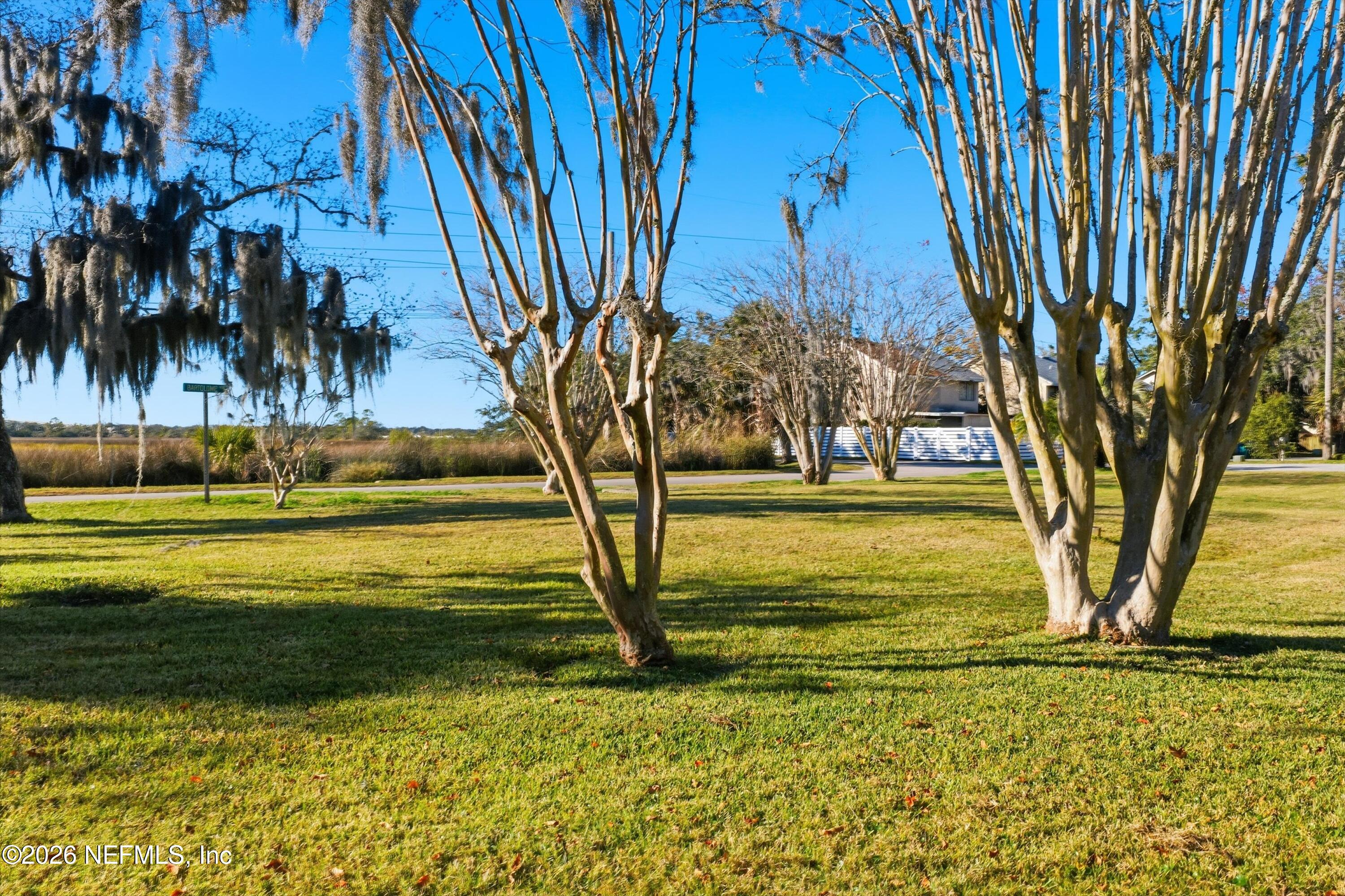 0 Marsh Point Road Neptune Beach, FL 32266 - Photo 11 of 14 a view of a swimming pool with an outdoor space and seating area