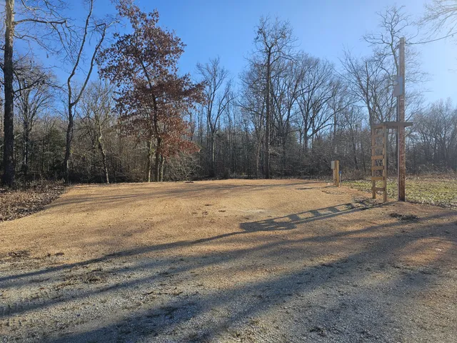 a view of road space with trees