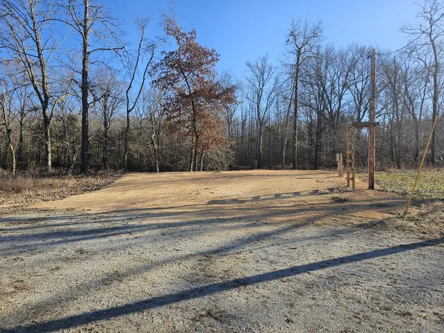 a view of the house with a yard