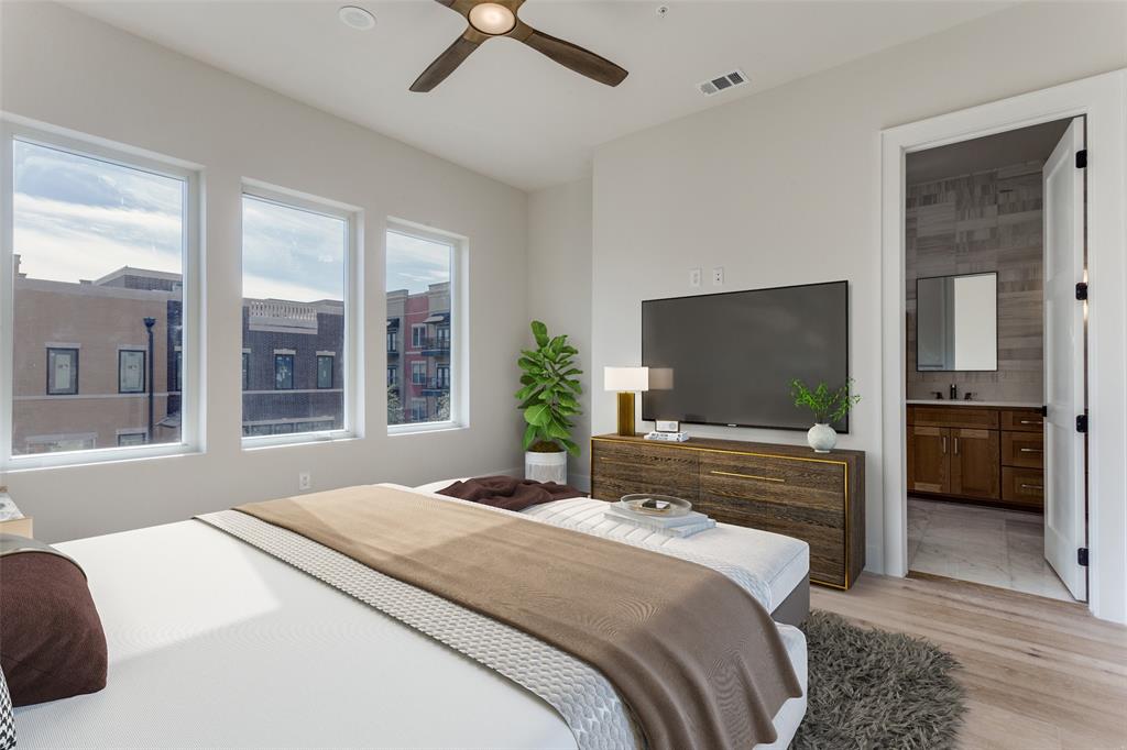 250 East Dallas Road, Unit 114 Grapevine, TX 76051 - Photo 20 of 33 a bedroom with a bed and a flat screen tv