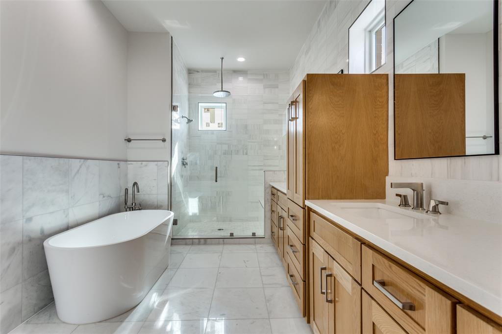 250 East Dallas Road, Unit 114 Grapevine, TX 76051 - Photo 22 of 33 a bathroom with a tub sink toilet and shower