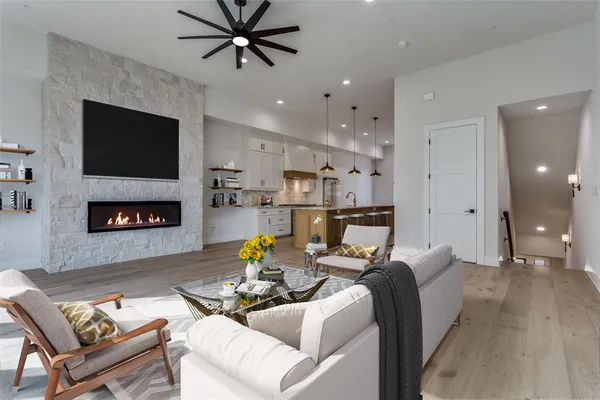 a view of a kitchen with a sink and a refrigerator