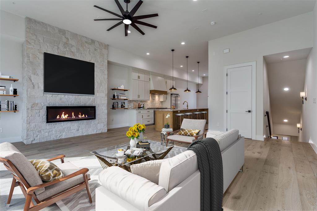 250 East Dallas Road, Unit 114 Grapevine, TX 76051 - Photo 8 of 33 a living room with furniture and a fireplace