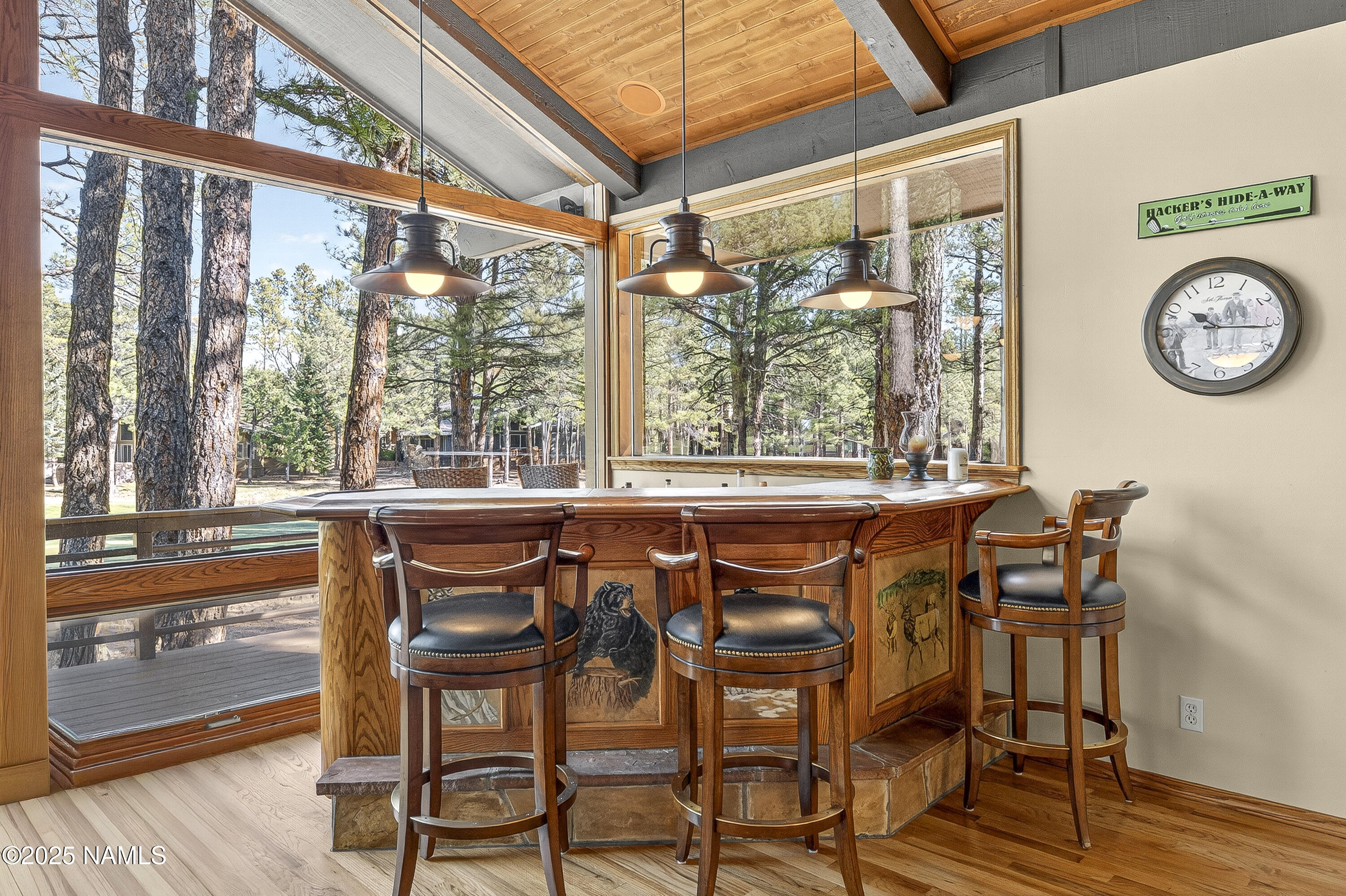 5790 Griffiths Spring Flagstaff, AZ 86005 - Photo 21 of 47 a view of a dining room with furniture window and wooden floor