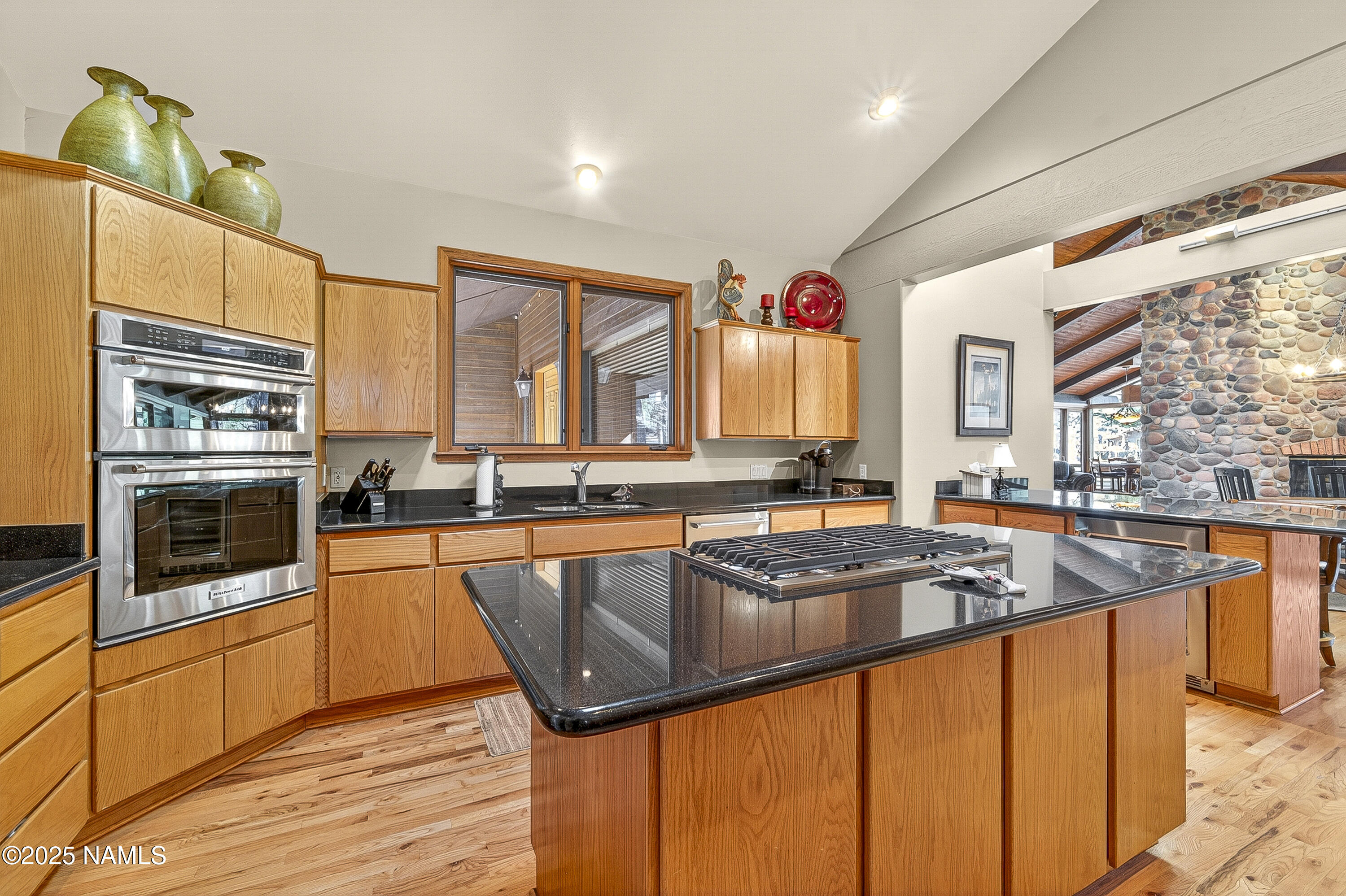 5790 Griffiths Spring Flagstaff, AZ 86005 - Photo 22 of 47 a kitchen with stainless steel appliances granite countertop a sink and a microwave