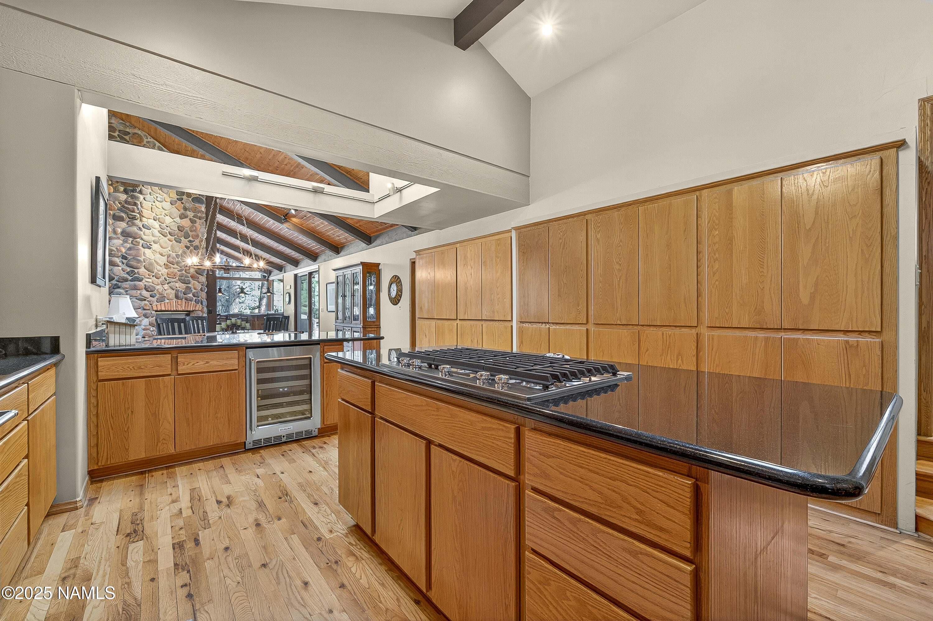 5790 Griffiths Spring Flagstaff, AZ 86005 - Photo 24 of 47 a kitchen with stainless steel appliances granite countertop a stove a sink dishwasher and cabinets with wooden floor