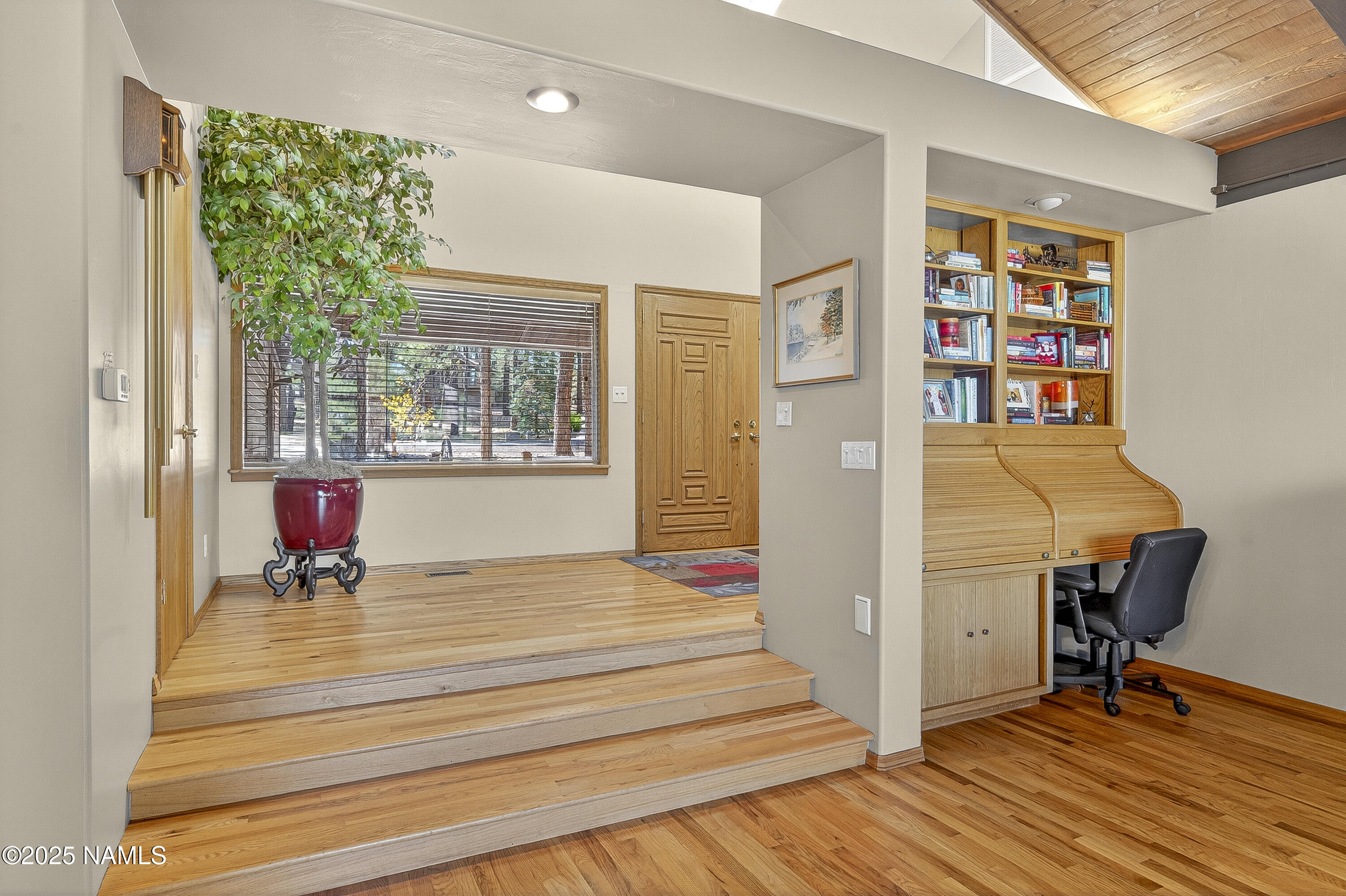 5790 Griffiths Spring Flagstaff, AZ 86005 - Photo 26 of 47 a bedroom with a bed and a table in it