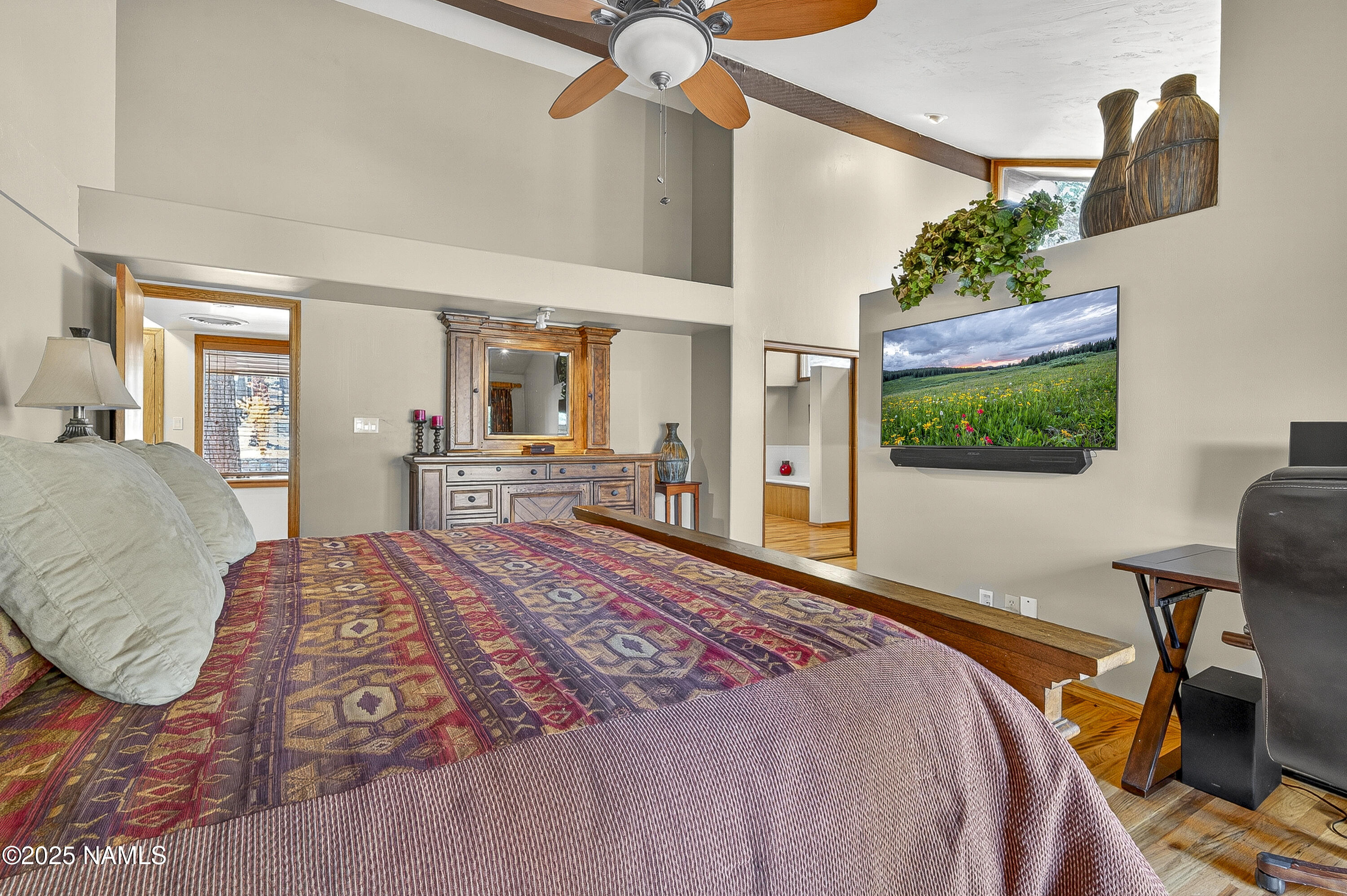 5790 Griffiths Spring Flagstaff, AZ 86005 - Photo 28 of 47 a bedroom with a bed and a flat screen tv