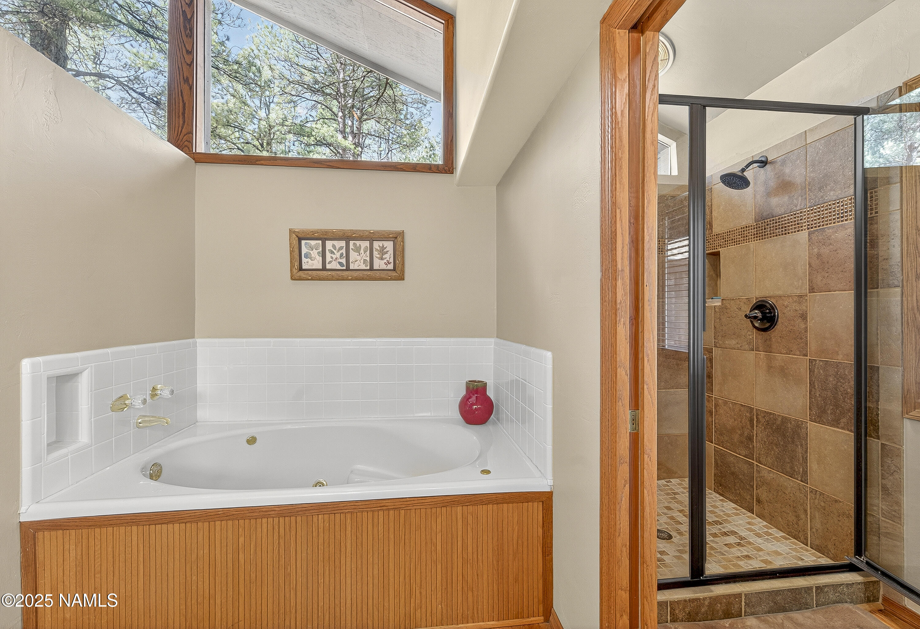 5790 Griffiths Spring Flagstaff, AZ 86005 - Photo 31 of 47 a bathroom with a tub shower and a window