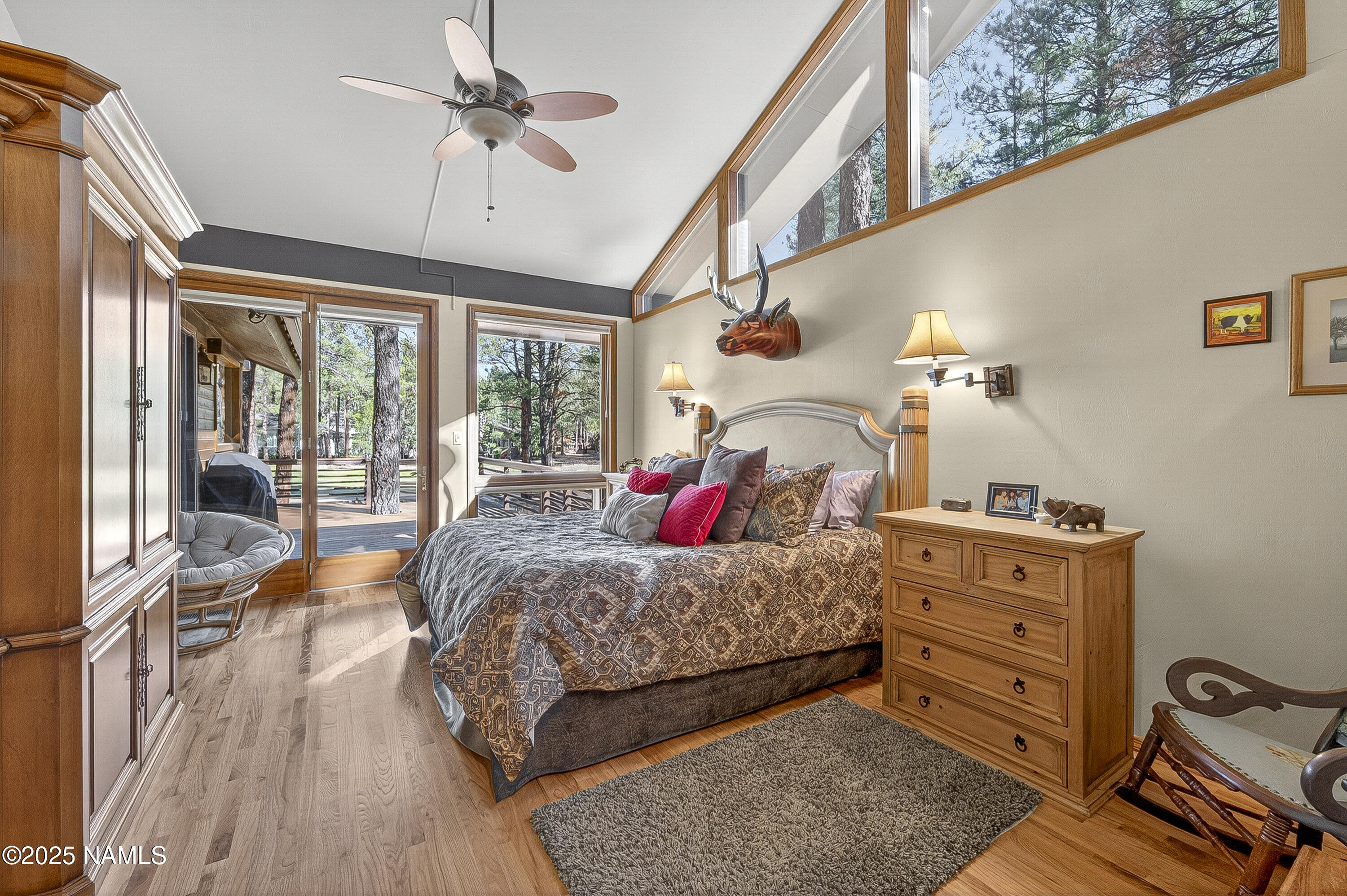 5790 Griffiths Spring Flagstaff, AZ 86005 - Photo 33 of 47 a bedroom with a bed and wooden floor