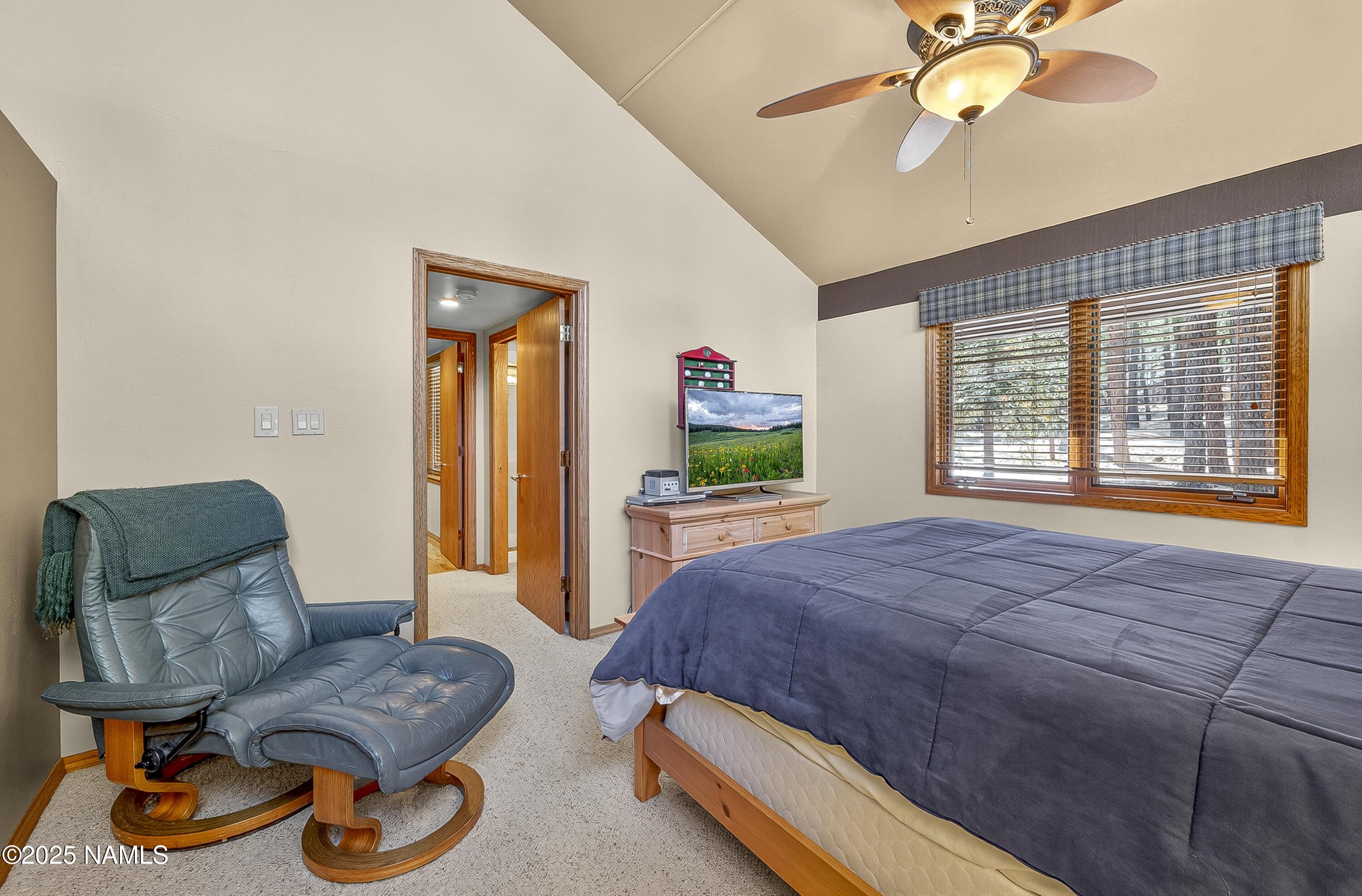 5790 Griffiths Spring Flagstaff, AZ 86005 - Photo 36 of 47 a bedroom with a bed and wooden floor
