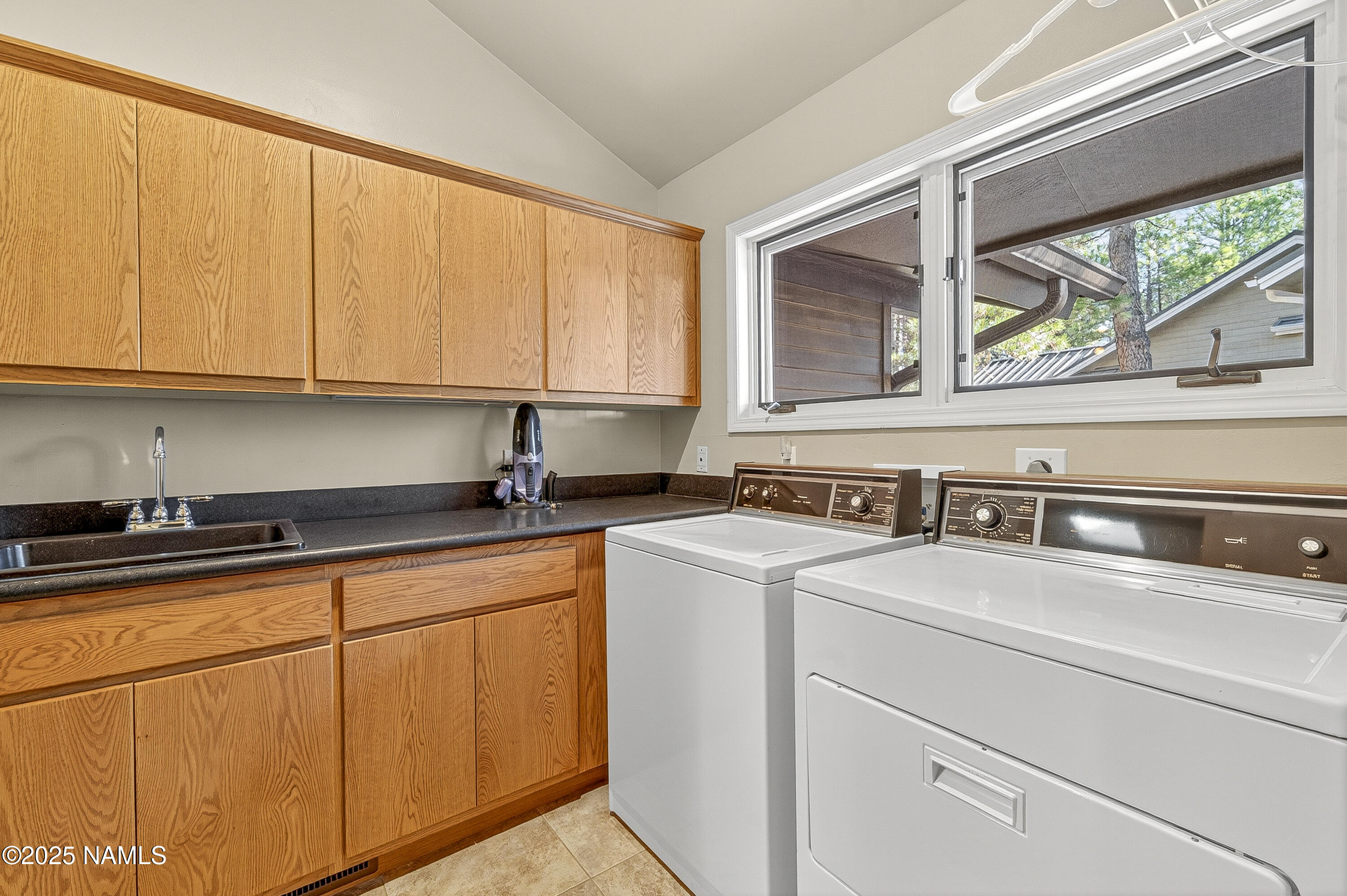 5790 Griffiths Spring Flagstaff, AZ 86005 - Photo 40 of 47 a kitchen with appliances cabinets and a sink