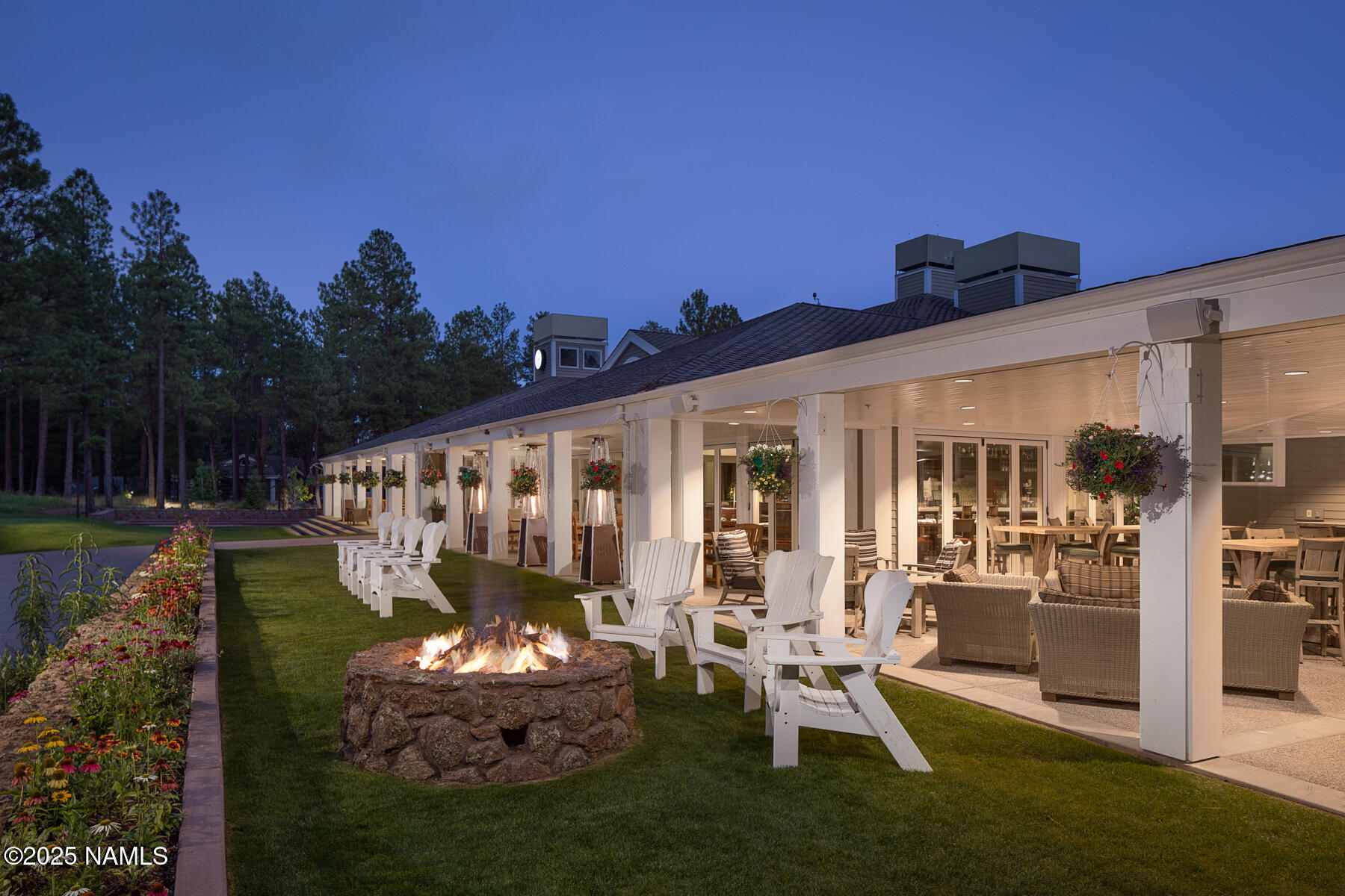5790 Griffiths Spring Flagstaff, AZ 86005 - Photo 42 of 47 a front view of a house with garden and sitting area