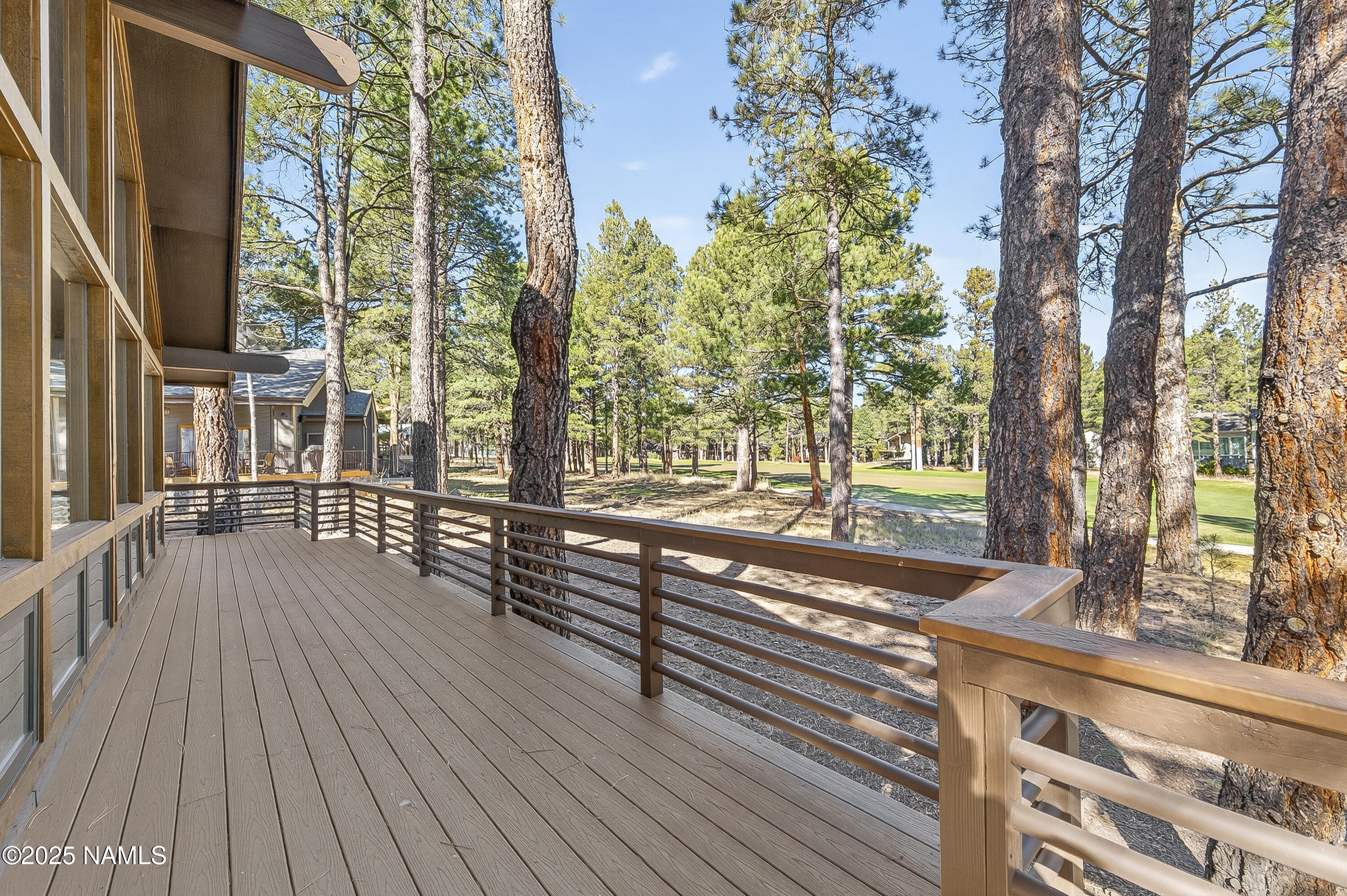 5790 Griffiths Spring Flagstaff, AZ 86005 - Photo 7 of 47 a view of a wooden deck with a yard