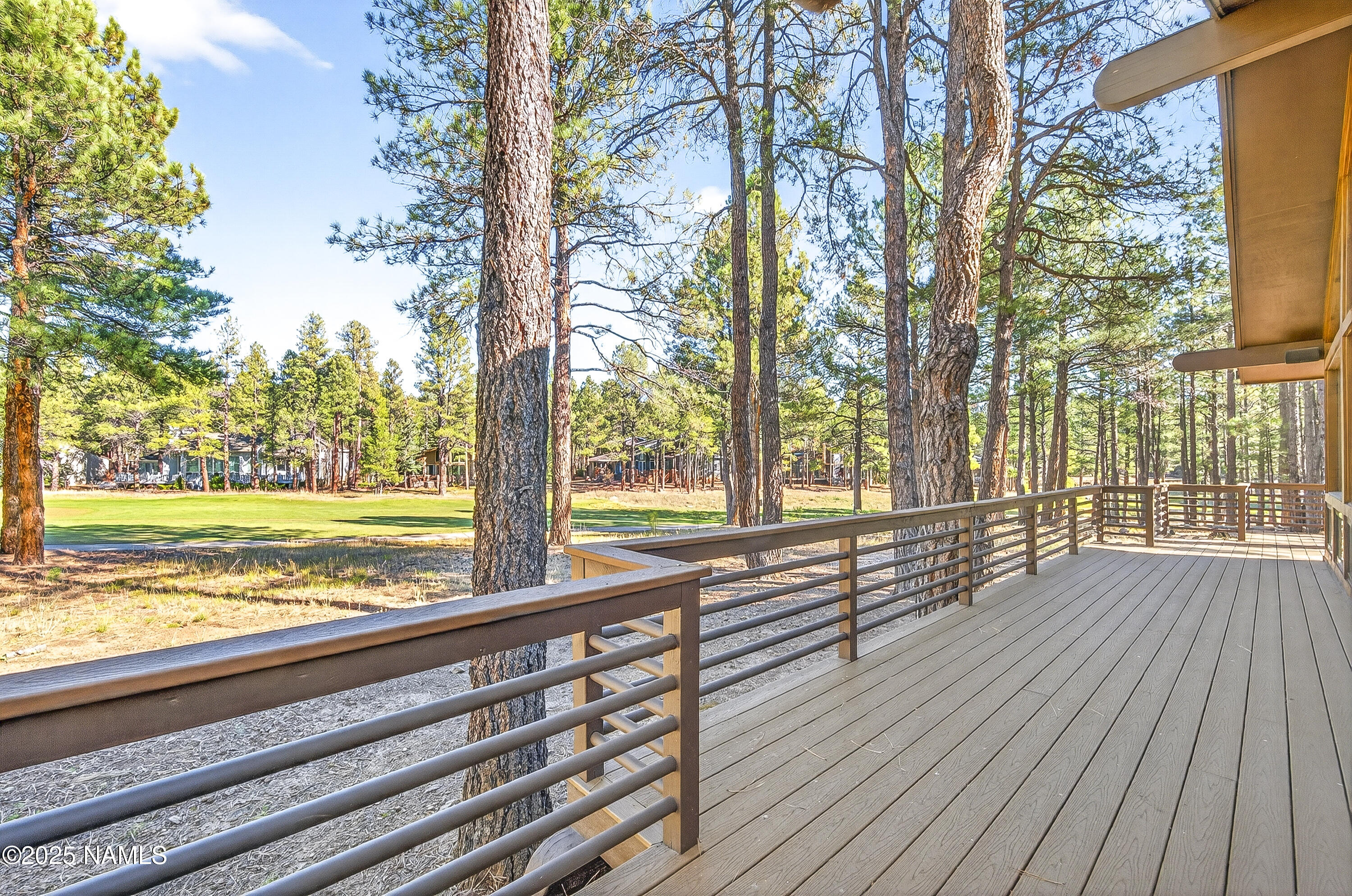 5790 Griffiths Spring Flagstaff, AZ 86005 - Photo 8 of 47 a view of a room with wooden floor and trees