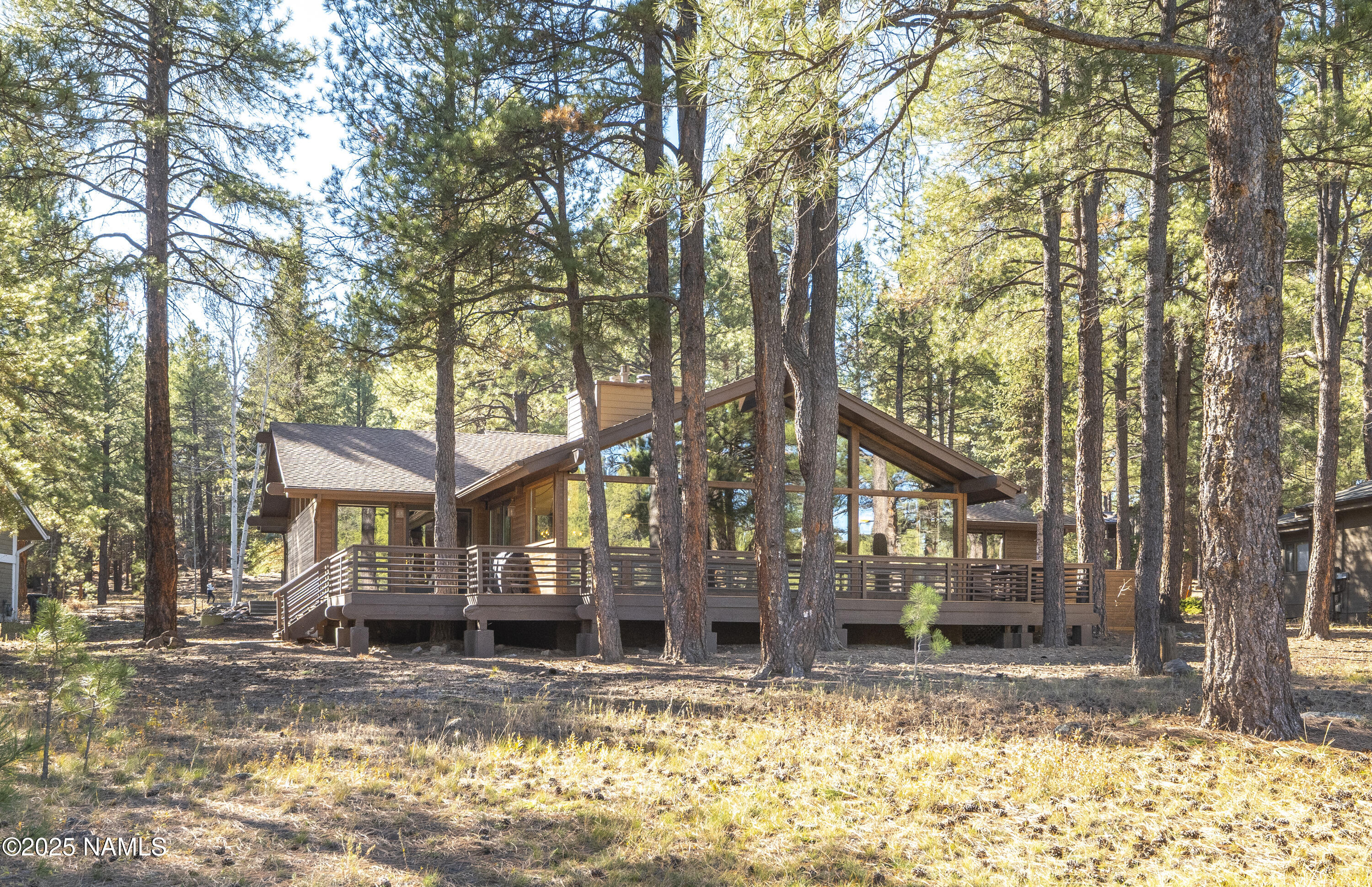 5790 Griffiths Spring Flagstaff, AZ 86005 - Photo 10 of 47 a front view of a house with a yard