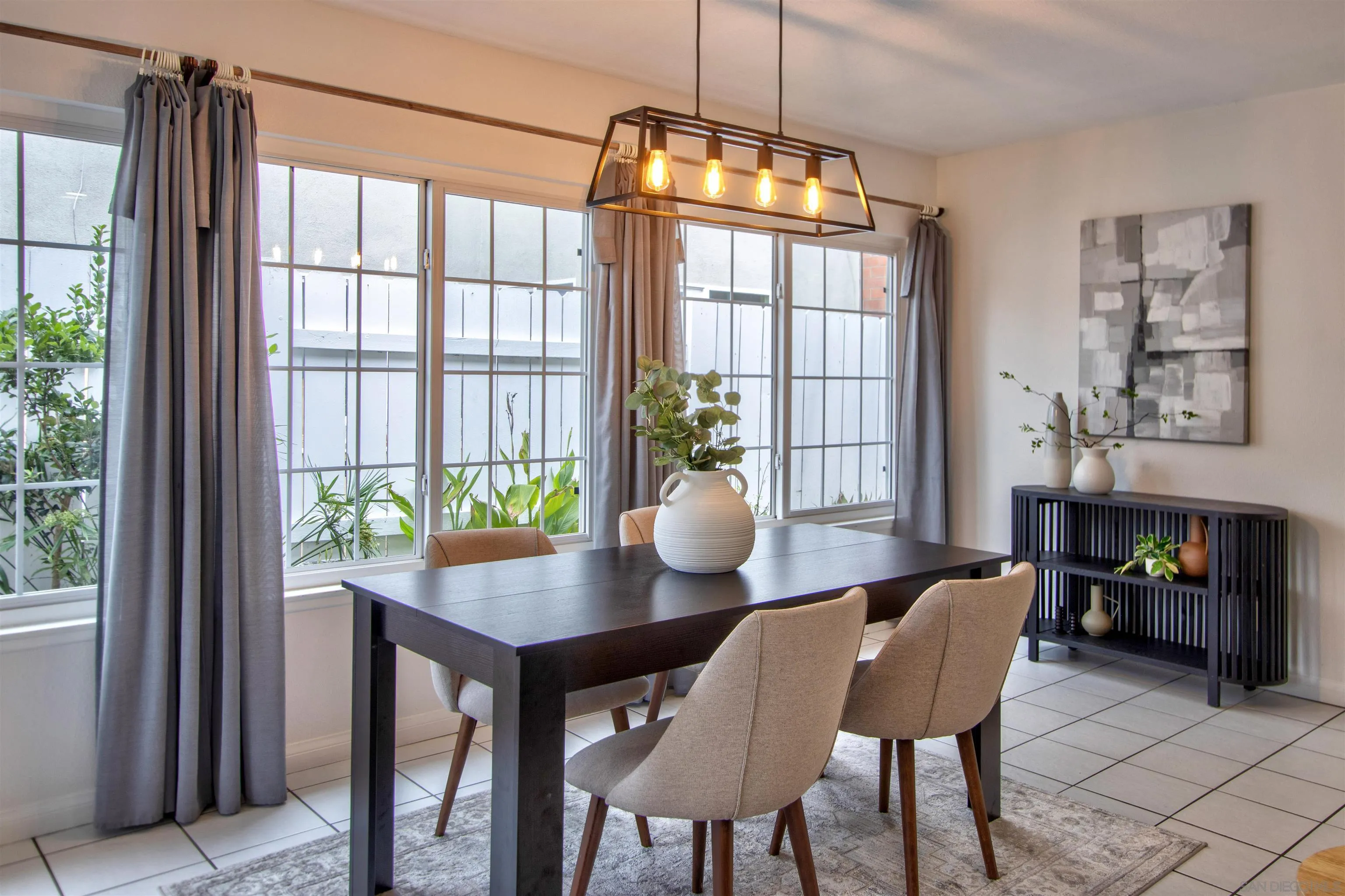 8450 Aries Road San Diego, CA 92126 - Photo 12 of 25 a view of a dining room with furniture window and wooden floor