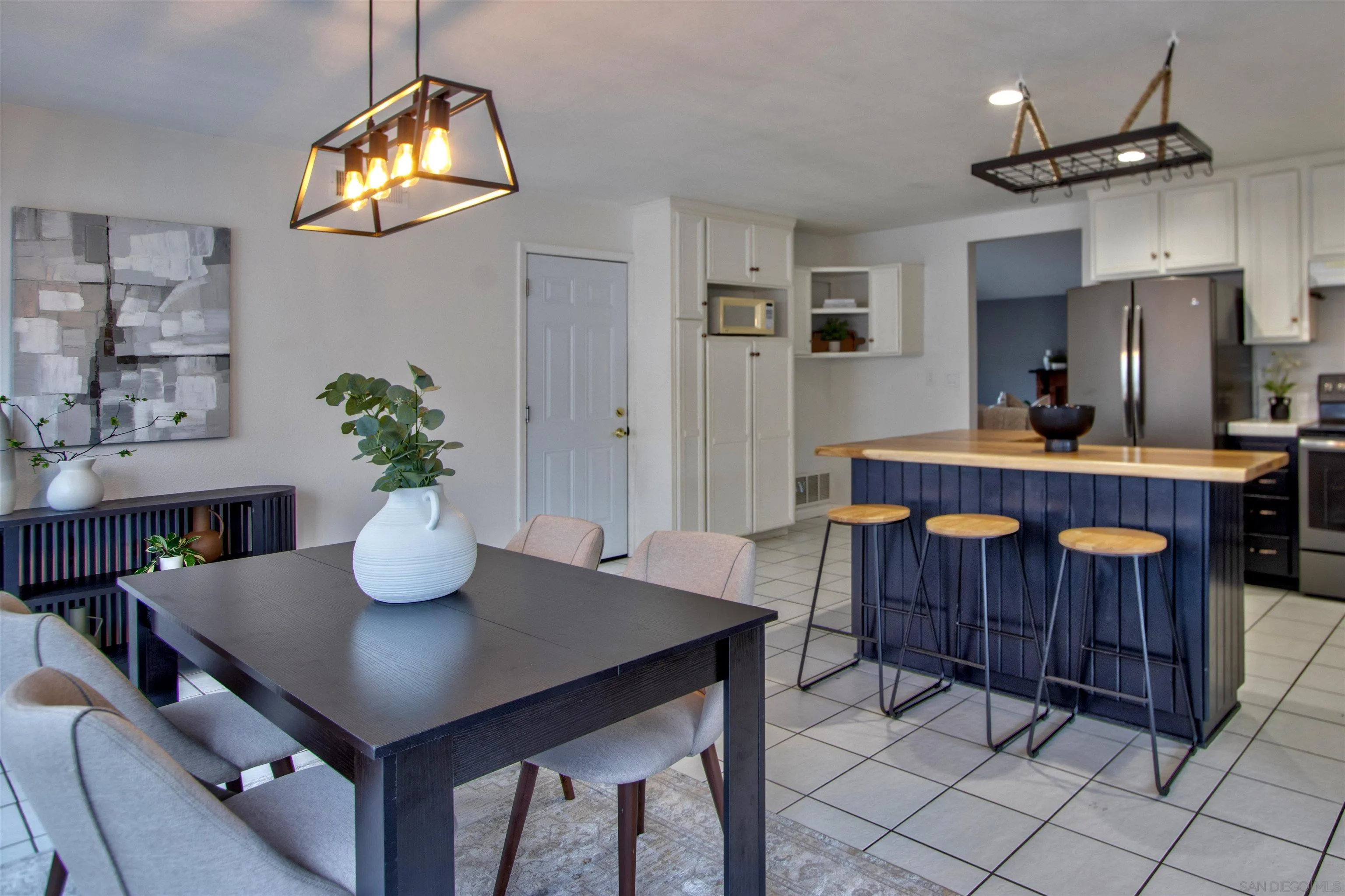8450 Aries Road San Diego, CA 92126 - Photo 13 of 25 a dining room with furniture and window