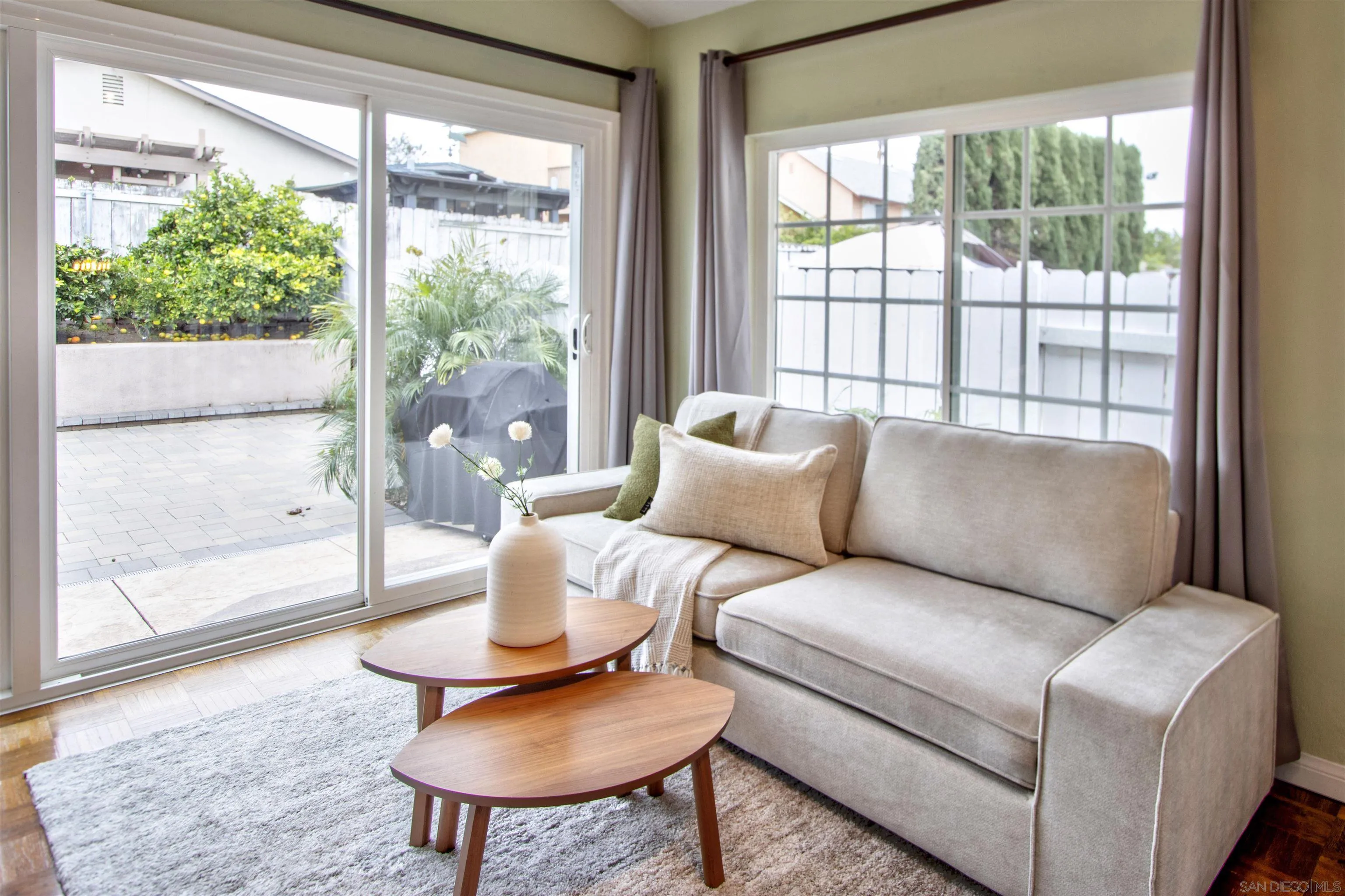 8450 Aries Road San Diego, CA 92126 - Photo 14 of 25 a living room with furniture and a large window