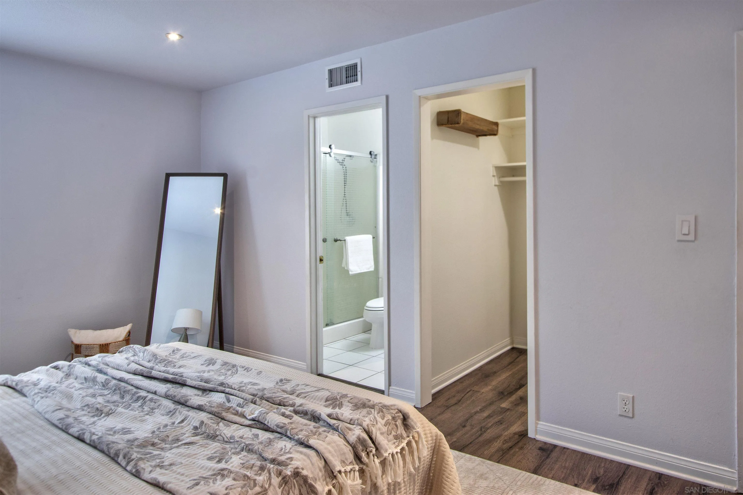 8450 Aries Road San Diego, CA 92126 - Photo 17 of 25 a bedroom with a bed and a mirror