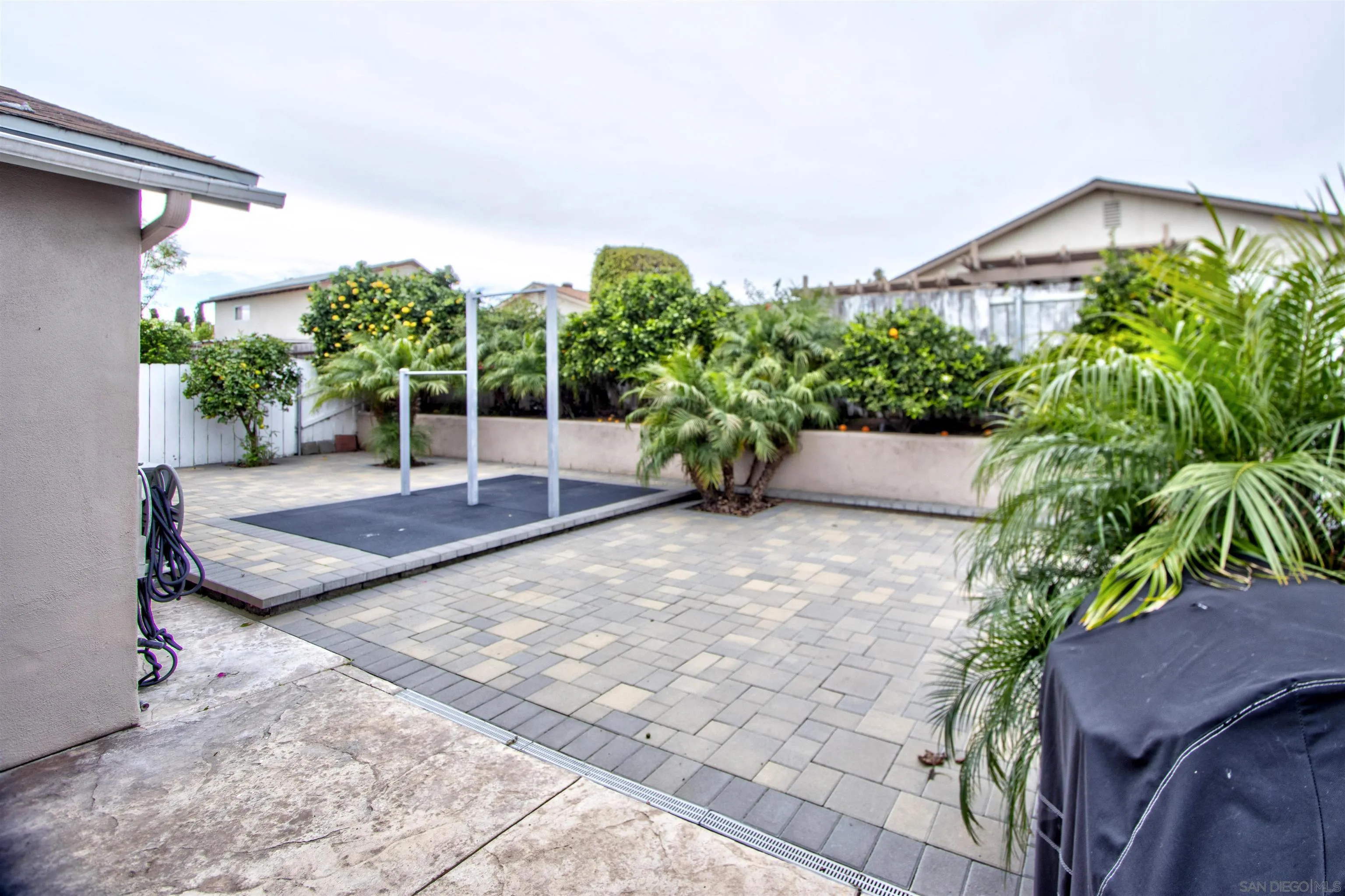 8450 Aries Road San Diego, CA 92126 - Photo 22 of 25 a view of a backyard with sitting area