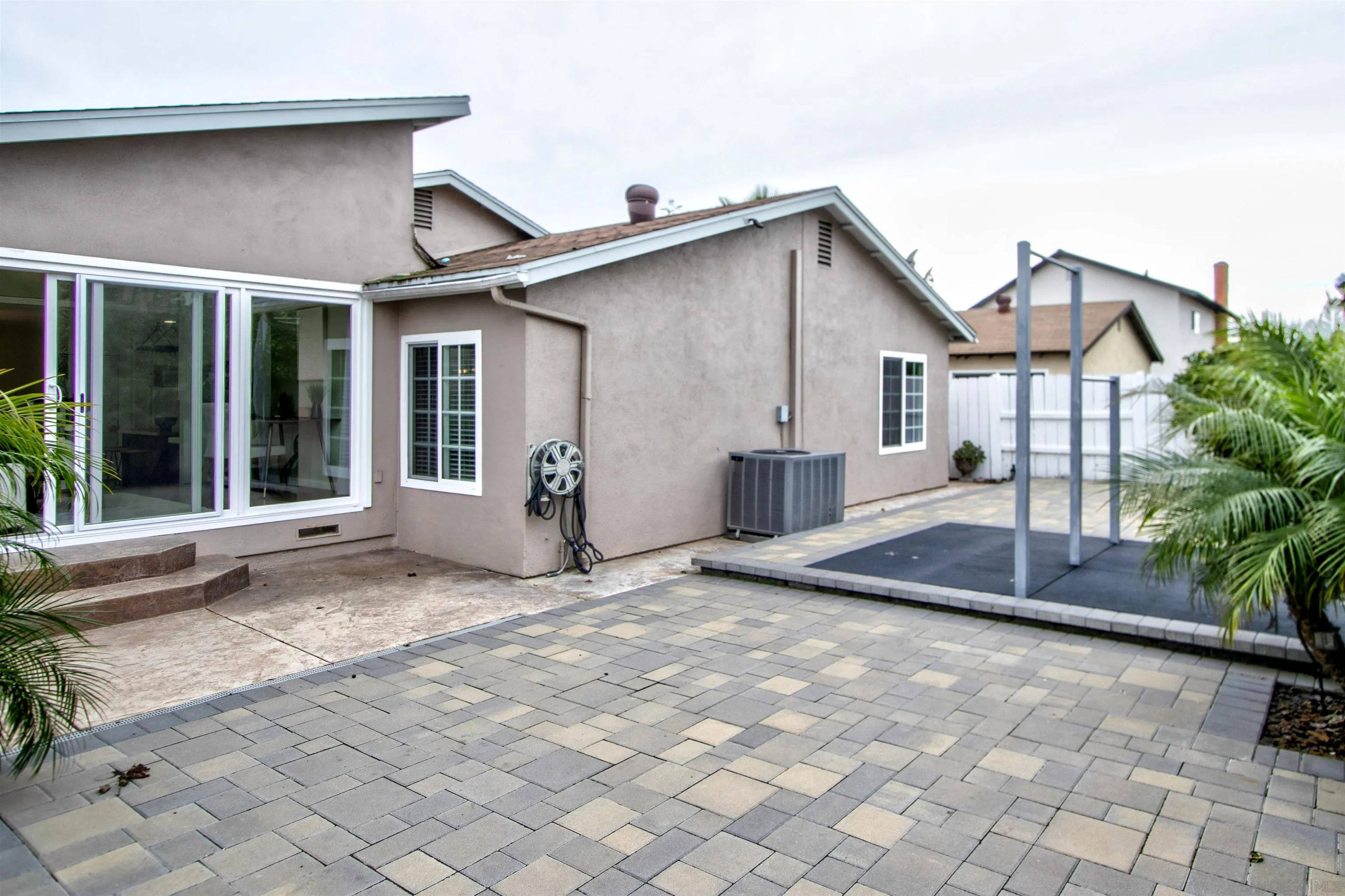 8450 Aries Road San Diego, CA 92126 - Photo 23 of 25 a view of a house with backyard