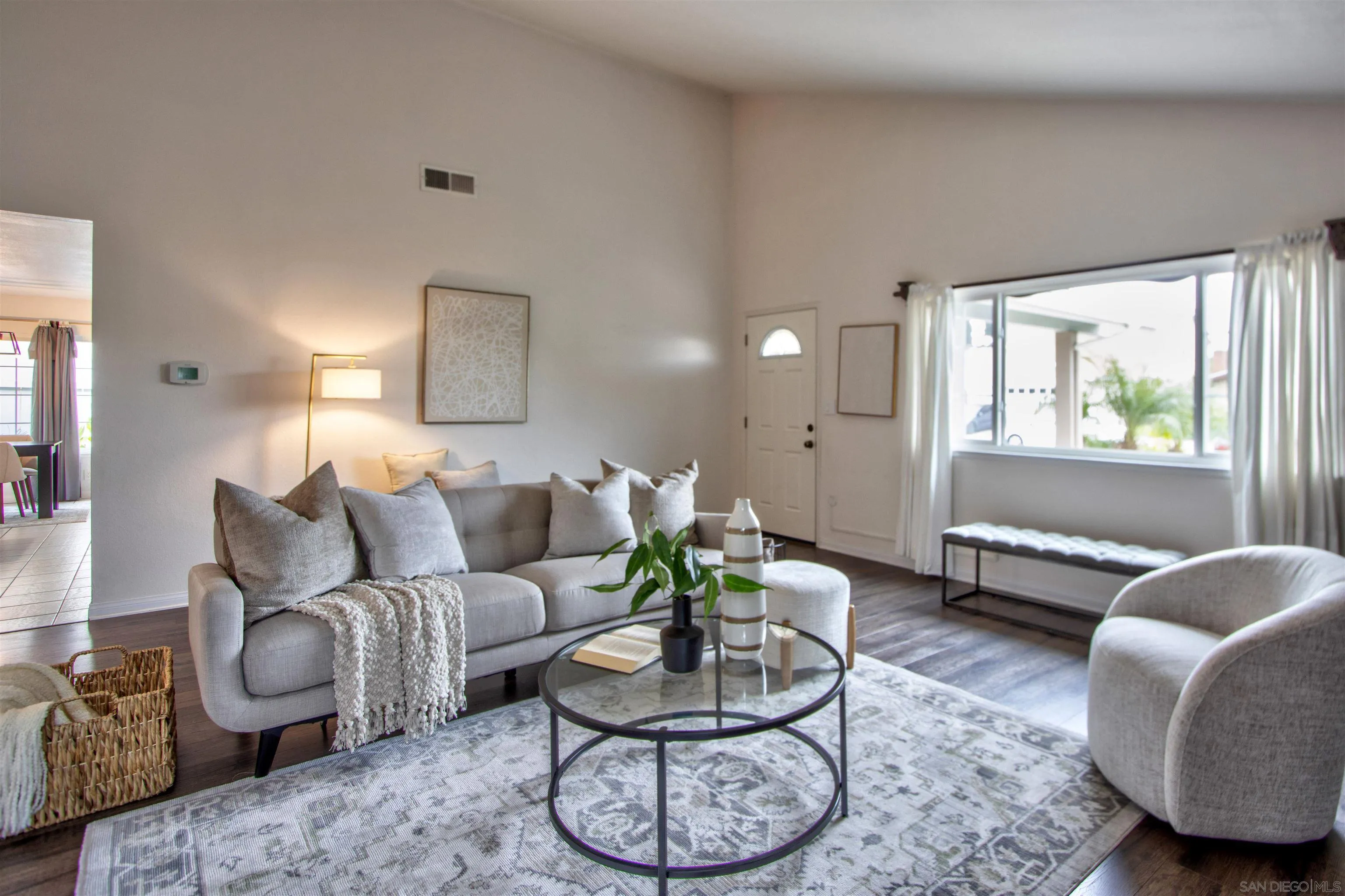 8450 Aries Road San Diego, CA 92126 - Photo 4 of 25 a living room with furniture and a wooden floor