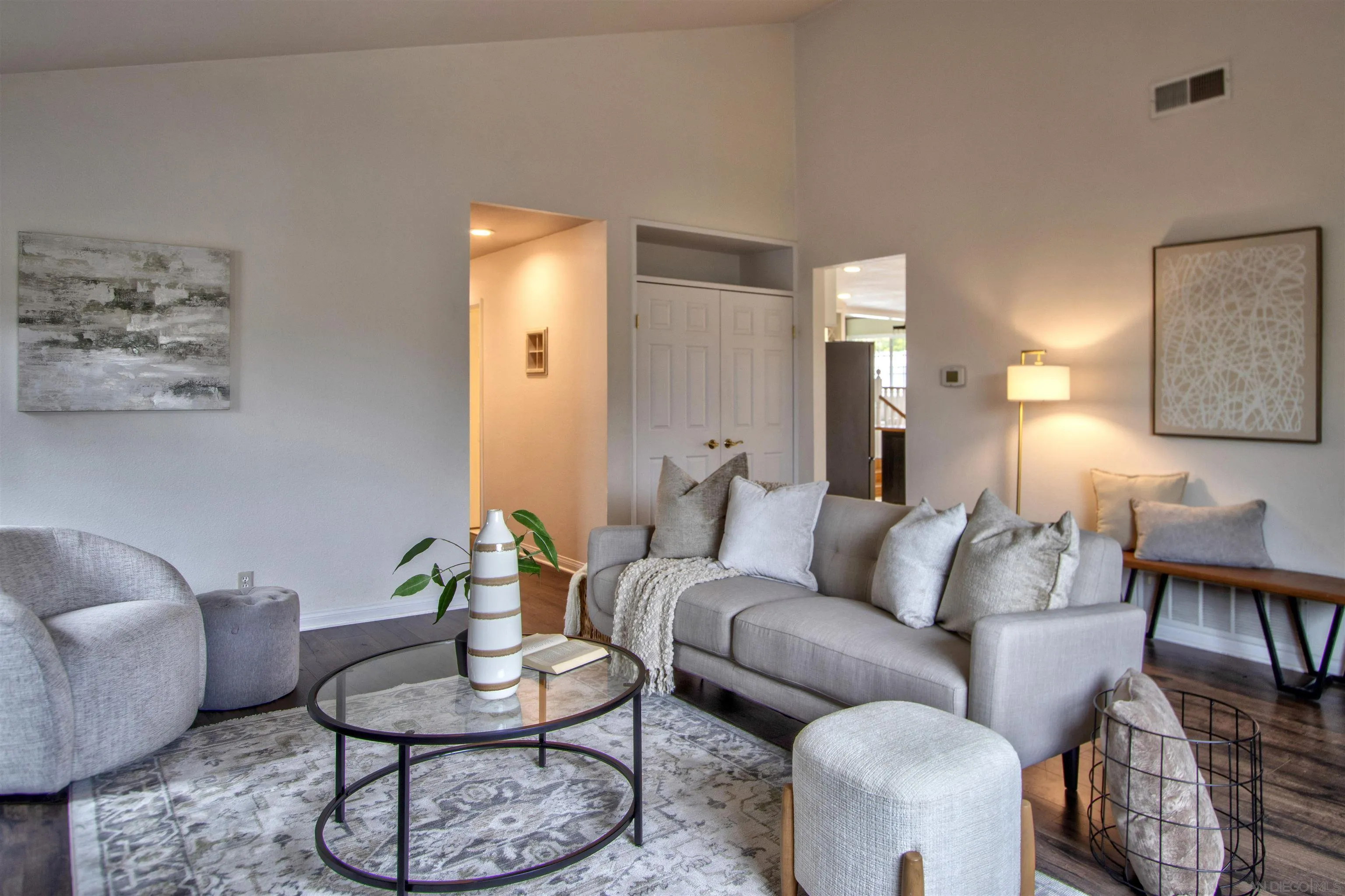 8450 Aries Road San Diego, CA 92126 - Photo 7 of 25 a living room with furniture and a painting on the wall