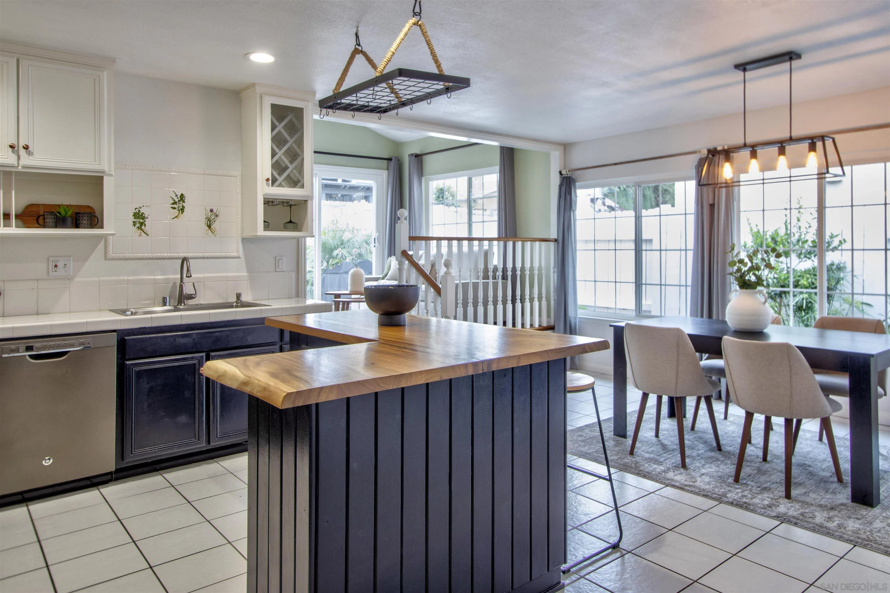 8450 Aries Road San Diego, CA 92126 - Photo 8 of 25 a kitchen with granite countertop a sink and counter space