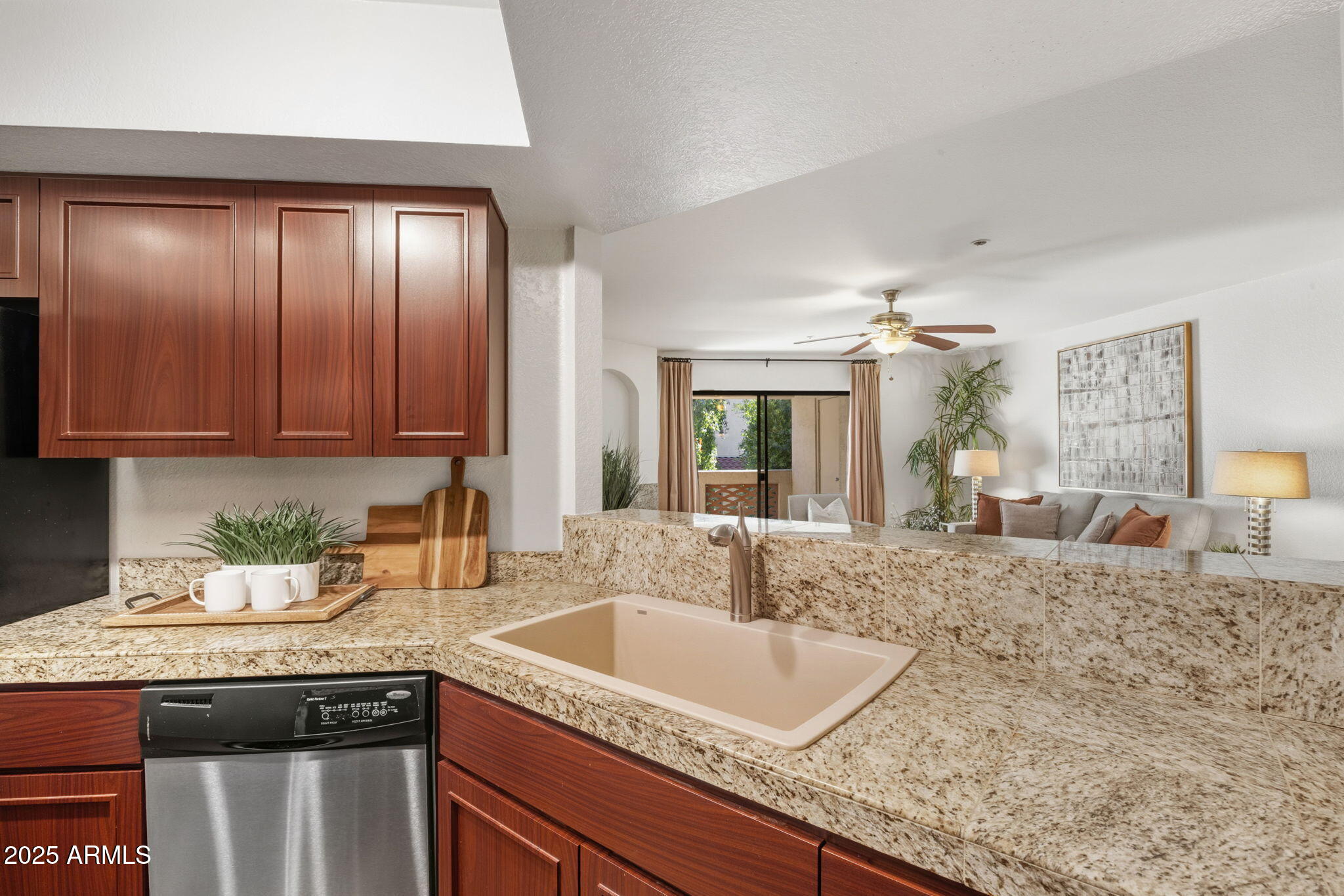 5104 North 32nd Street, Unit 344 Phoenix, AZ 85018 - Photo 14 of 30 a kitchen with granite countertop a sink a stove and cabinets