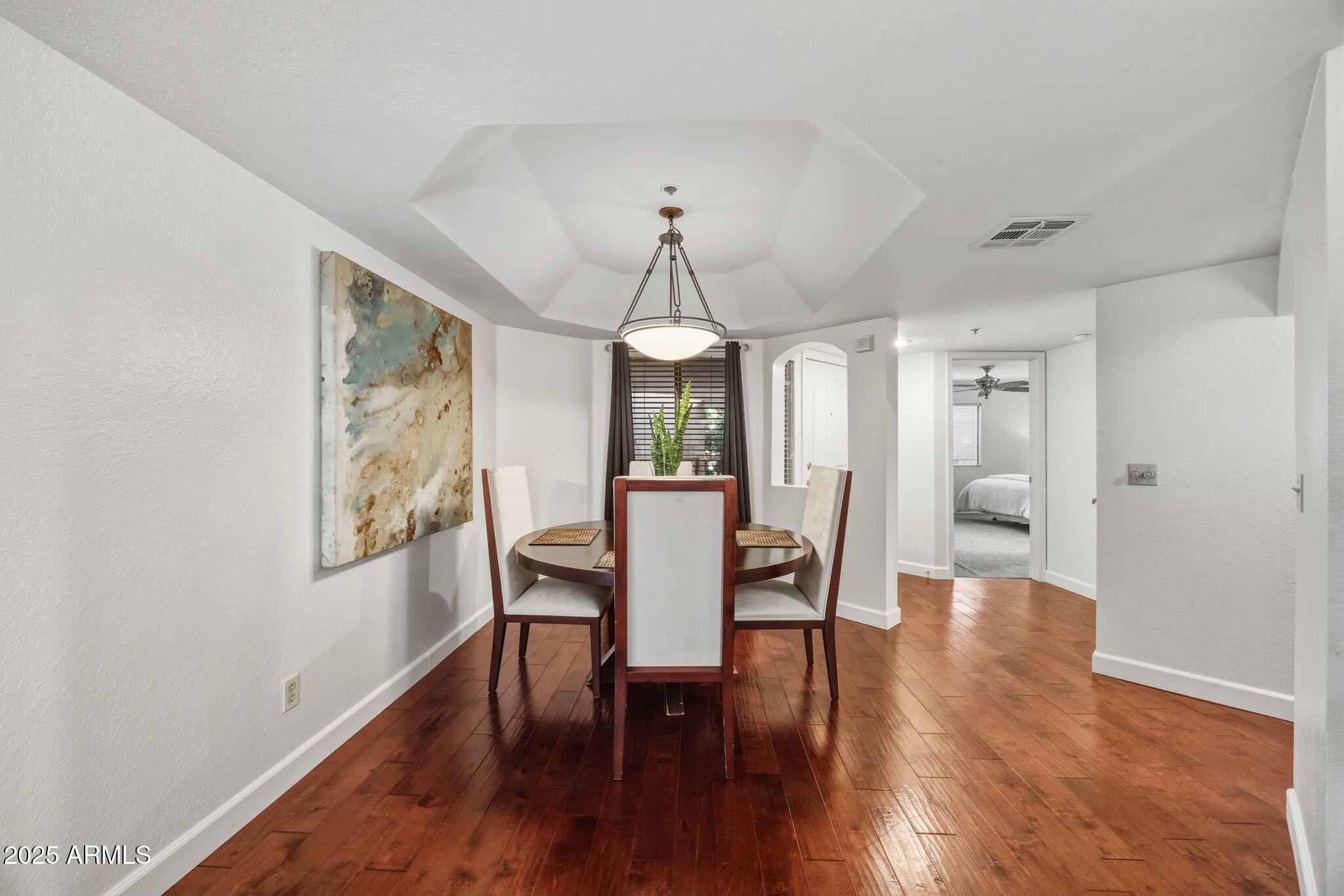 5104 North 32nd Street, Unit 344 Phoenix, AZ 85018 - Photo 15 of 30 a view of a dining room with furniture and wooden floor